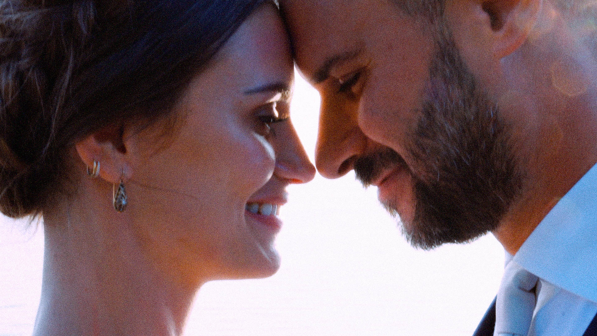 Close-up portrait of a happy couple sharing a tender moment at their wedding on Lake Garda