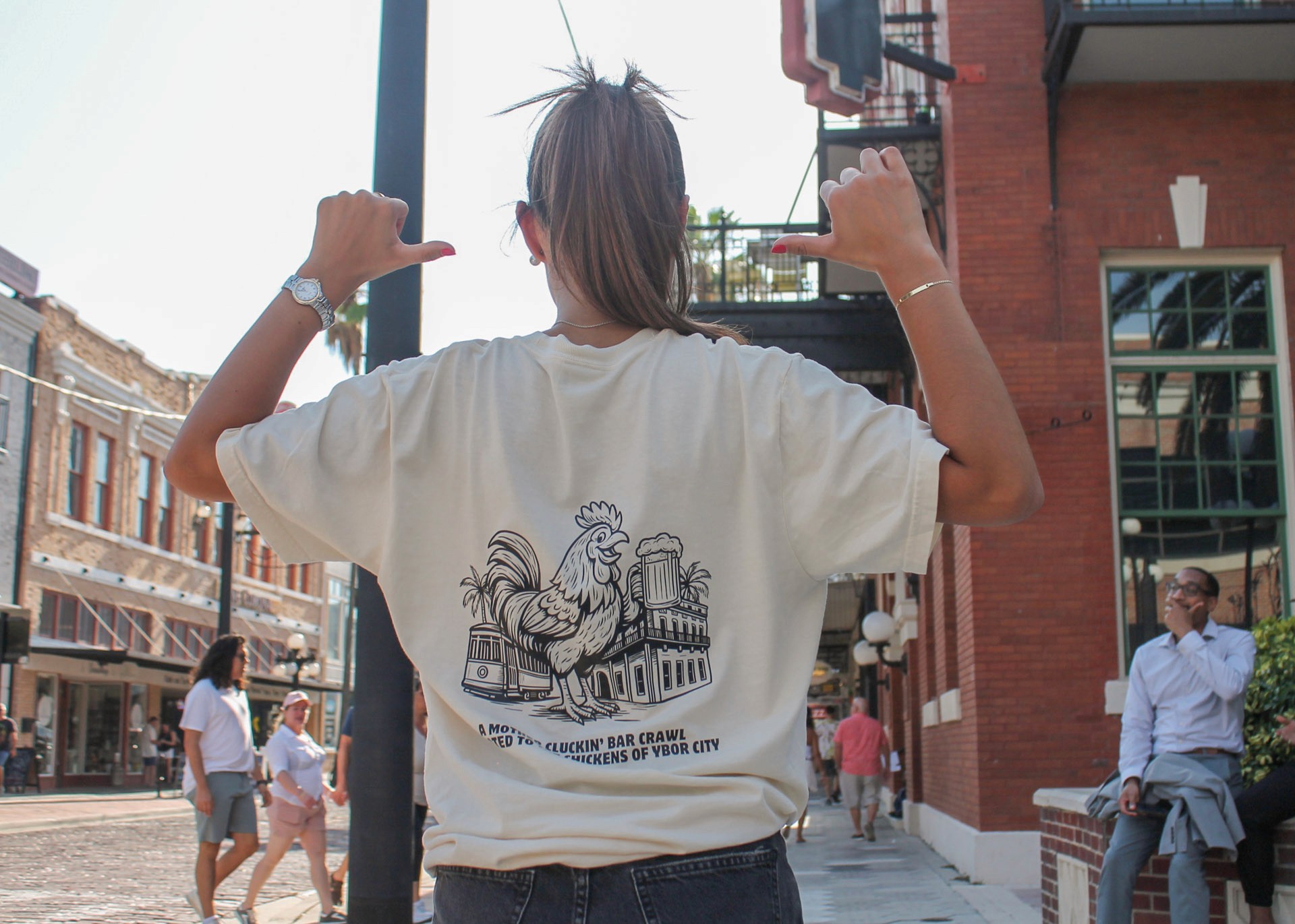 Woman wearing Roost & Rally shirt