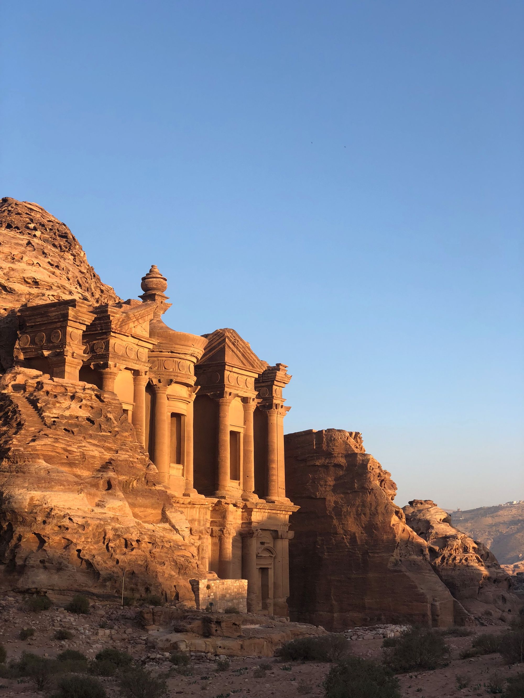Carved stone façade of the Monastery at Petra, Jordan