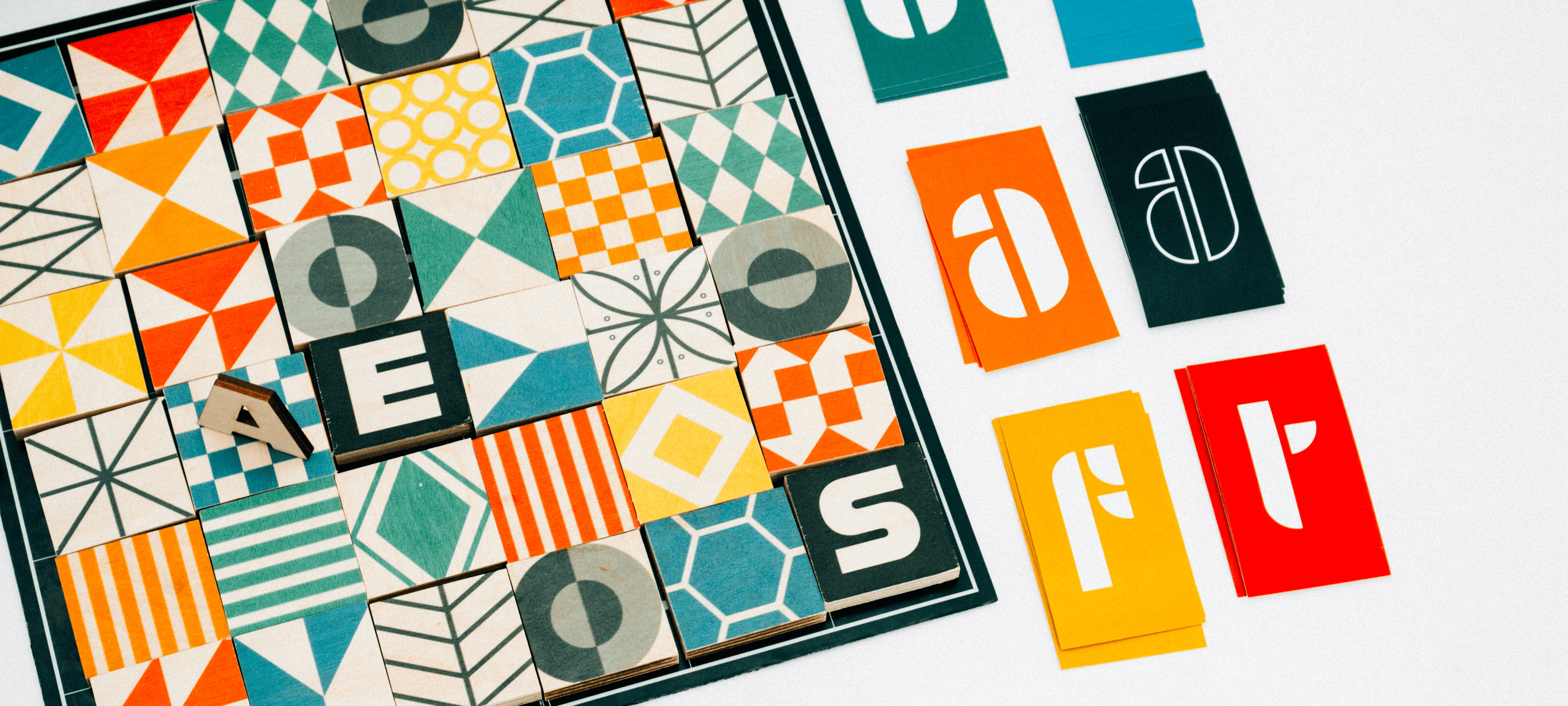 Modern home office setup with a monitor, ergonomic chair, keyboard, and indoor plants near a window with blinds.