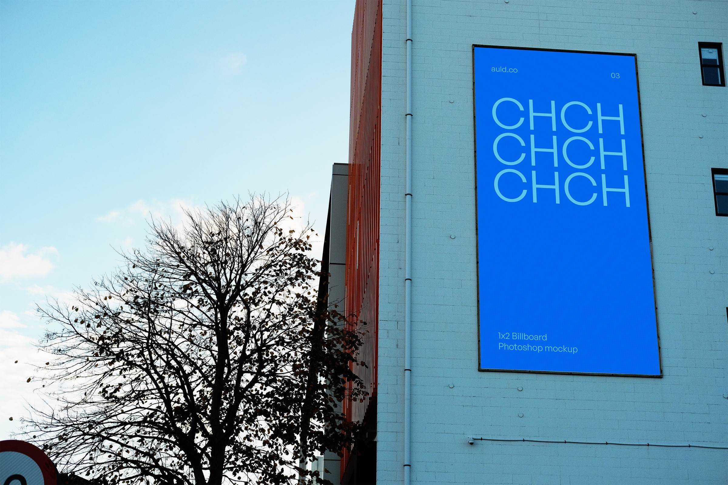 Blue Christchurch mockup artwork on a tall billboard beside a tree.