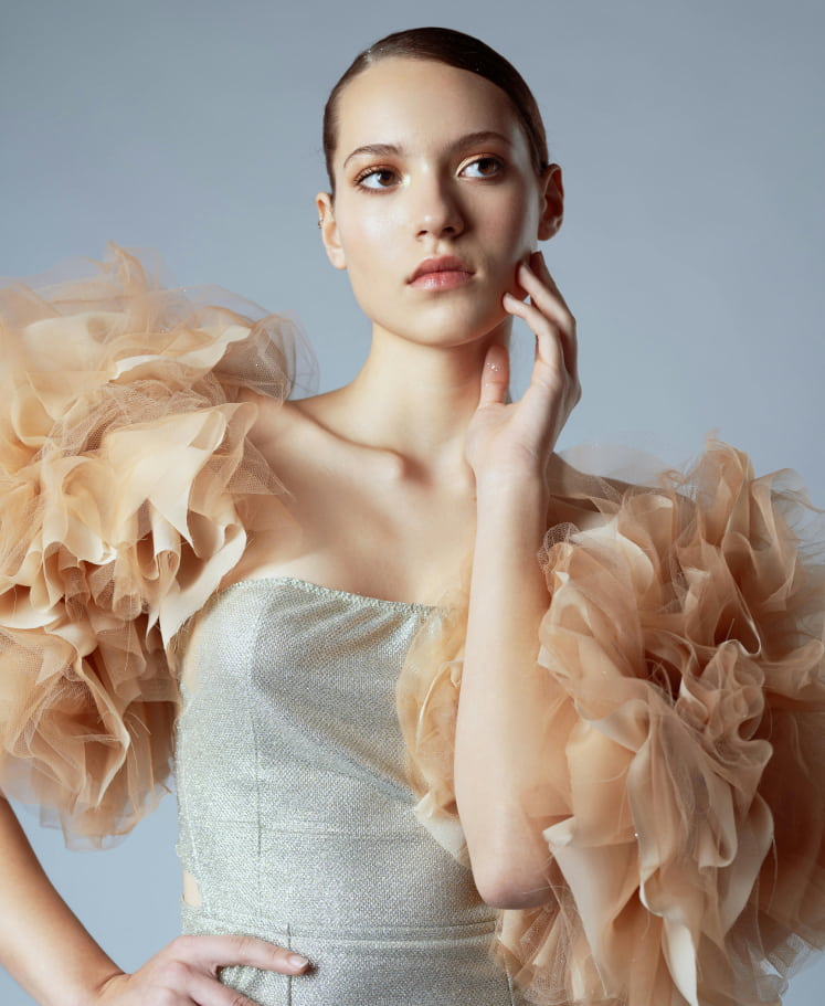 Fashion photoshoot with a woman posing in a dress