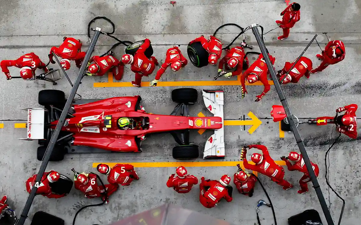 High-performance formula 1 pit crew servicing car in under 10 seconds