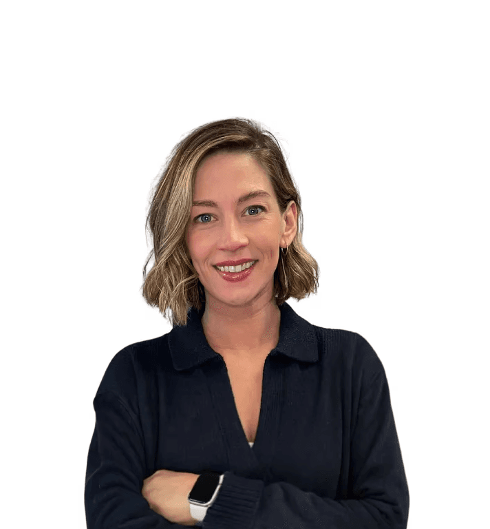 Melanie Reis, vestibular rehab specialist at Total Physio, smiling with her arms folded.