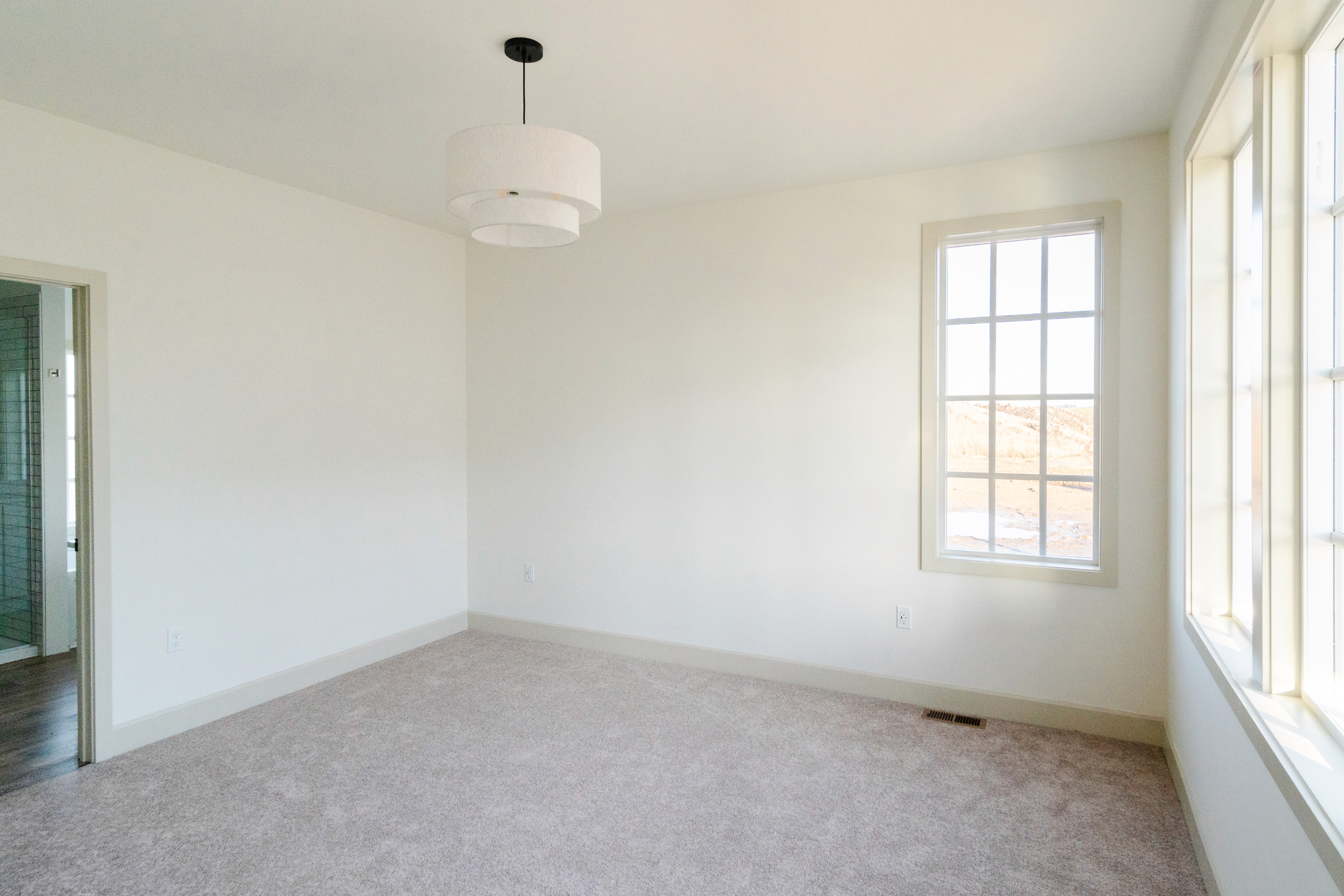 Carpeted master bedroom 