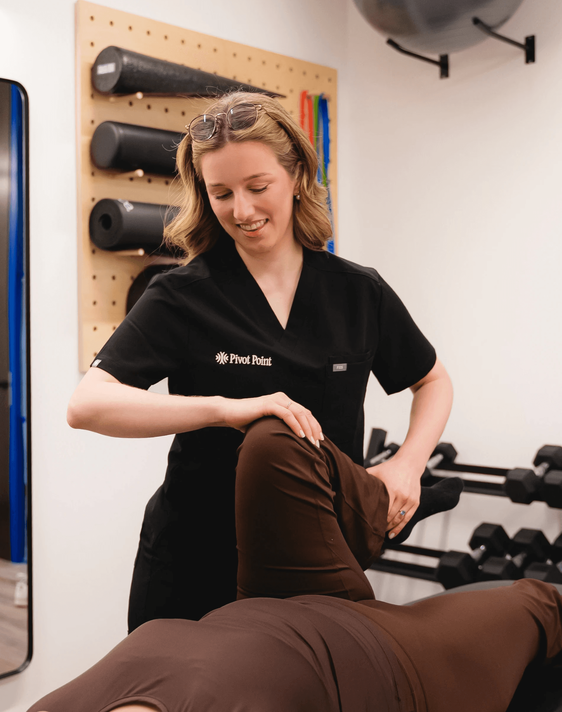 A physiotherapist treating a patients hip