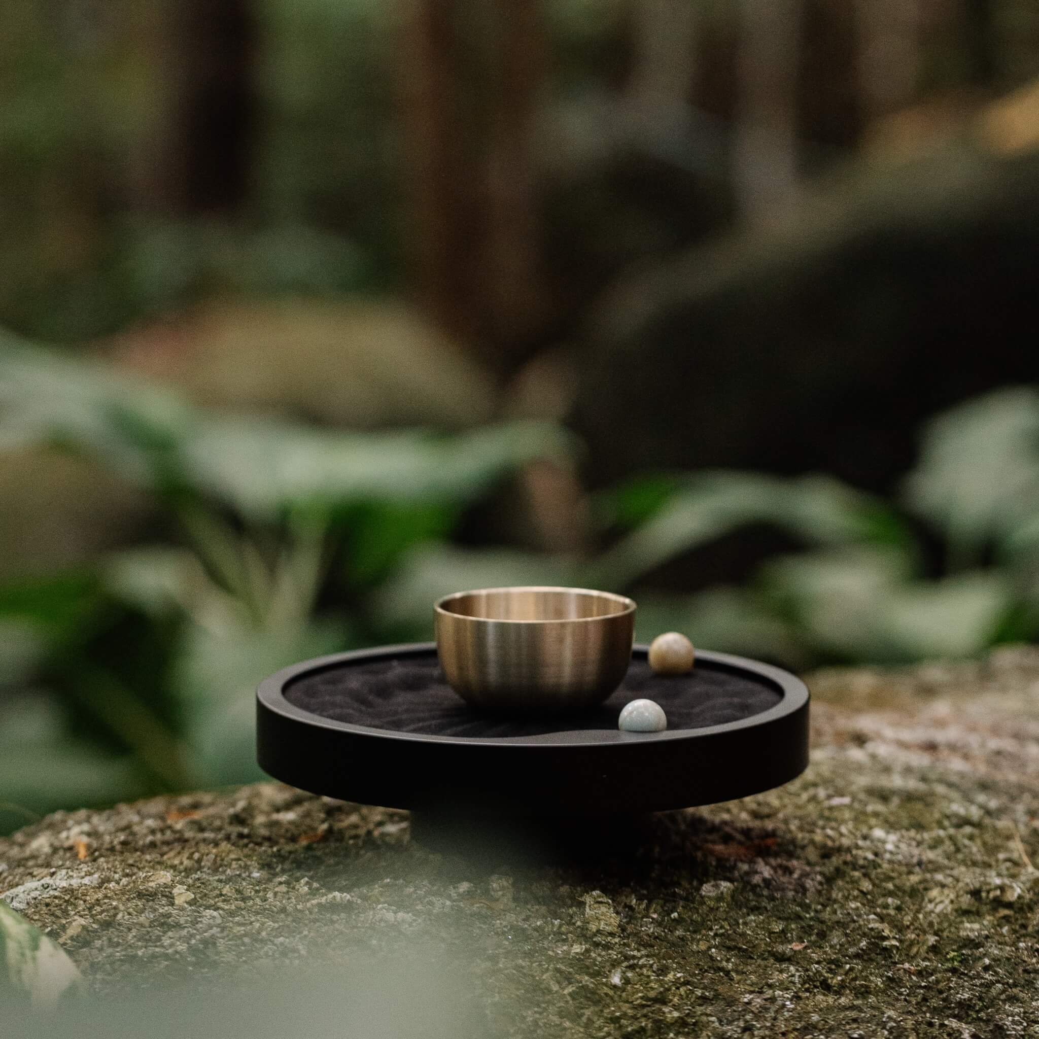 Man journaling with white taoo timer on wooden desk 