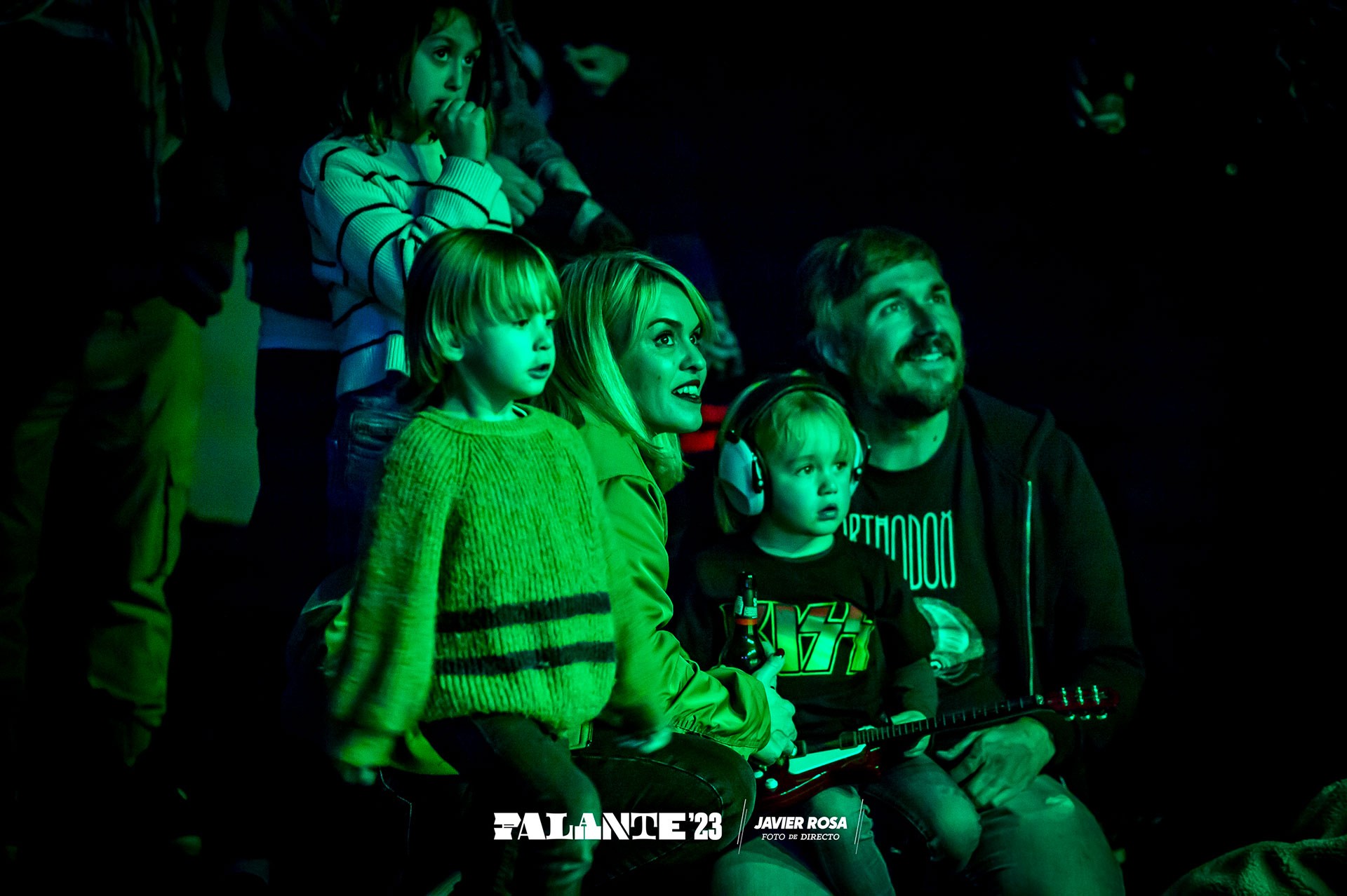 Excited crowd at a colorful concert