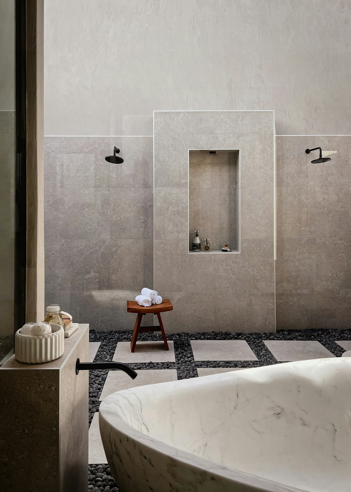 Travertine bathroom with a freestanding tub and a stone floor