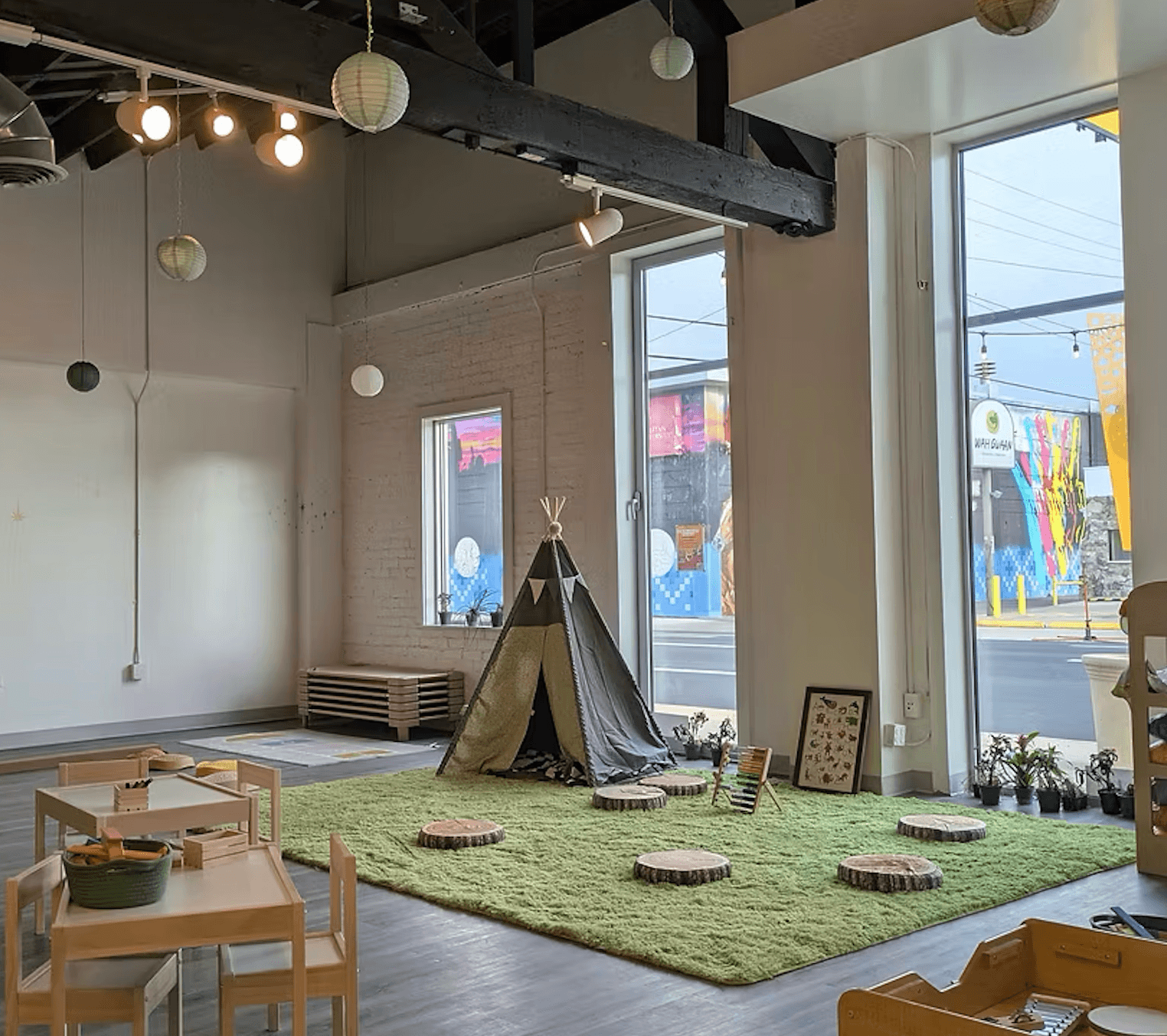 girl in blue denim dungaree pants holding blue and white polka dot handbag