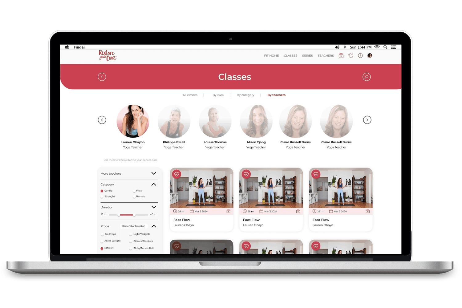 Laptop displaying Restore Your Core online fitness class platform with yoga instructors and workout video library.