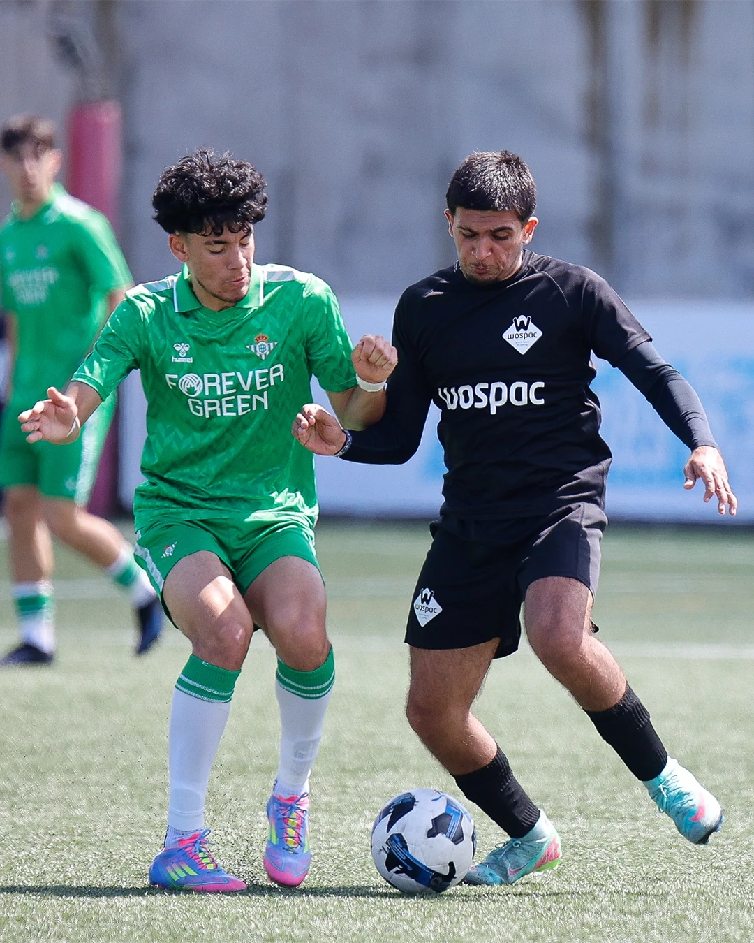 Man in VR headset interacts with green holographic code displayed on a curved screen.