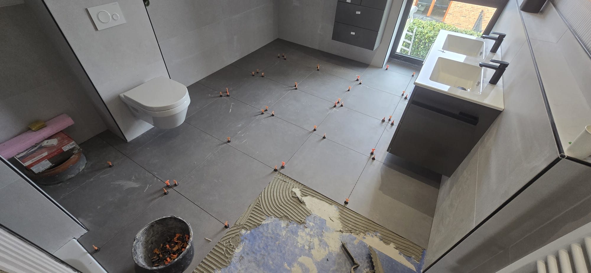 white ceramic toilet bowl near vanity combo