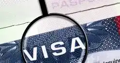 A passport with a tourist visa stamp.