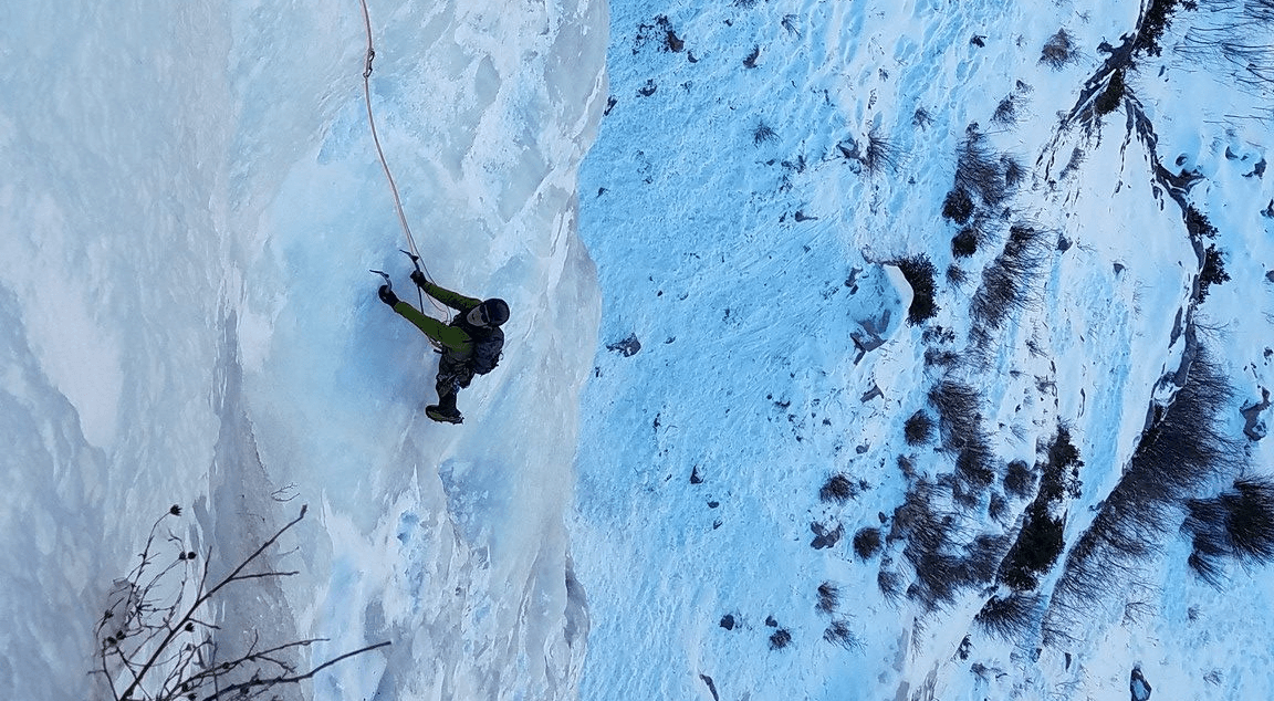 Climber in Lake City looks up ice climb as they folllow pitch