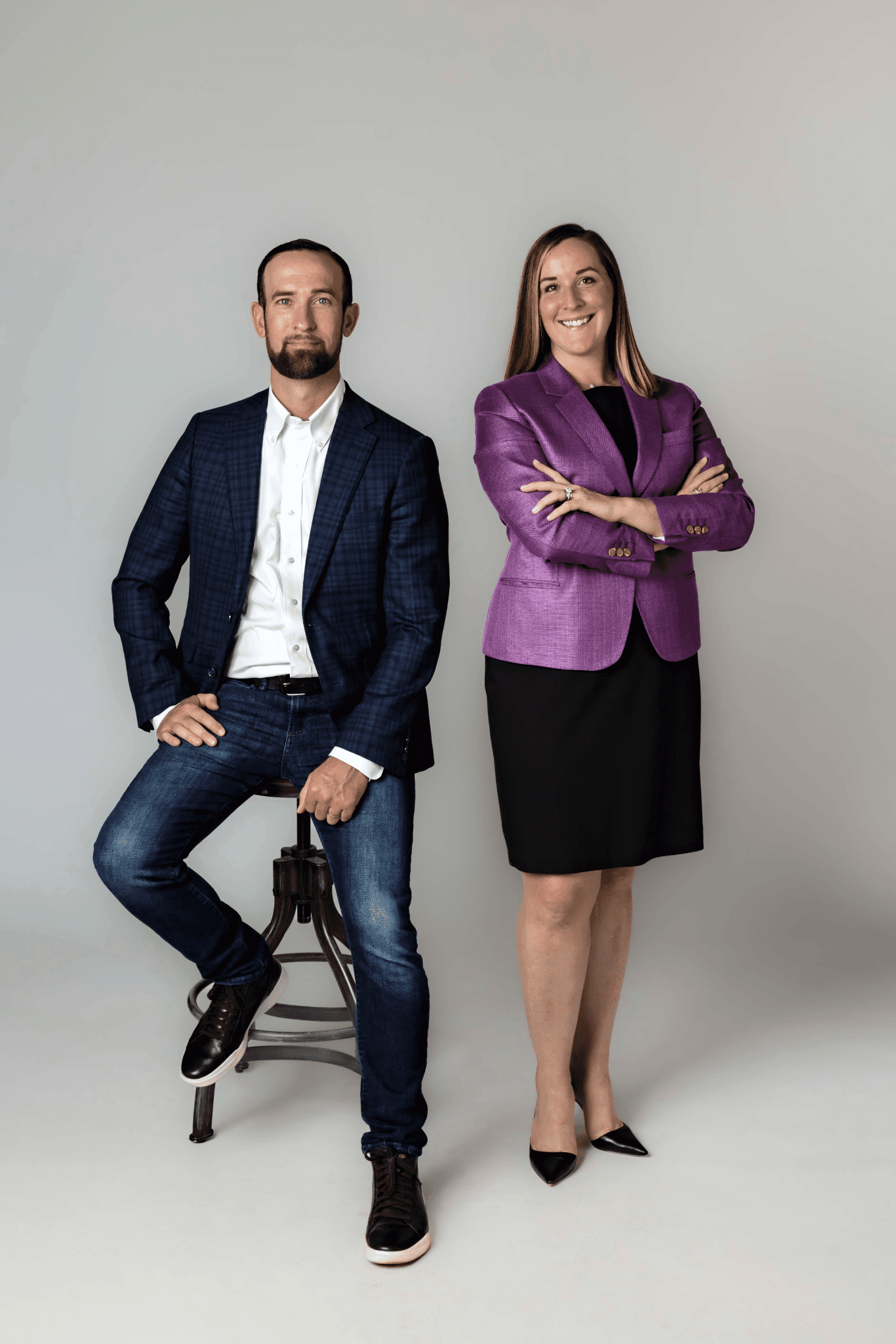 Chris Seegers seated beside Tara Seegers in professional attire against a neutral studio background.