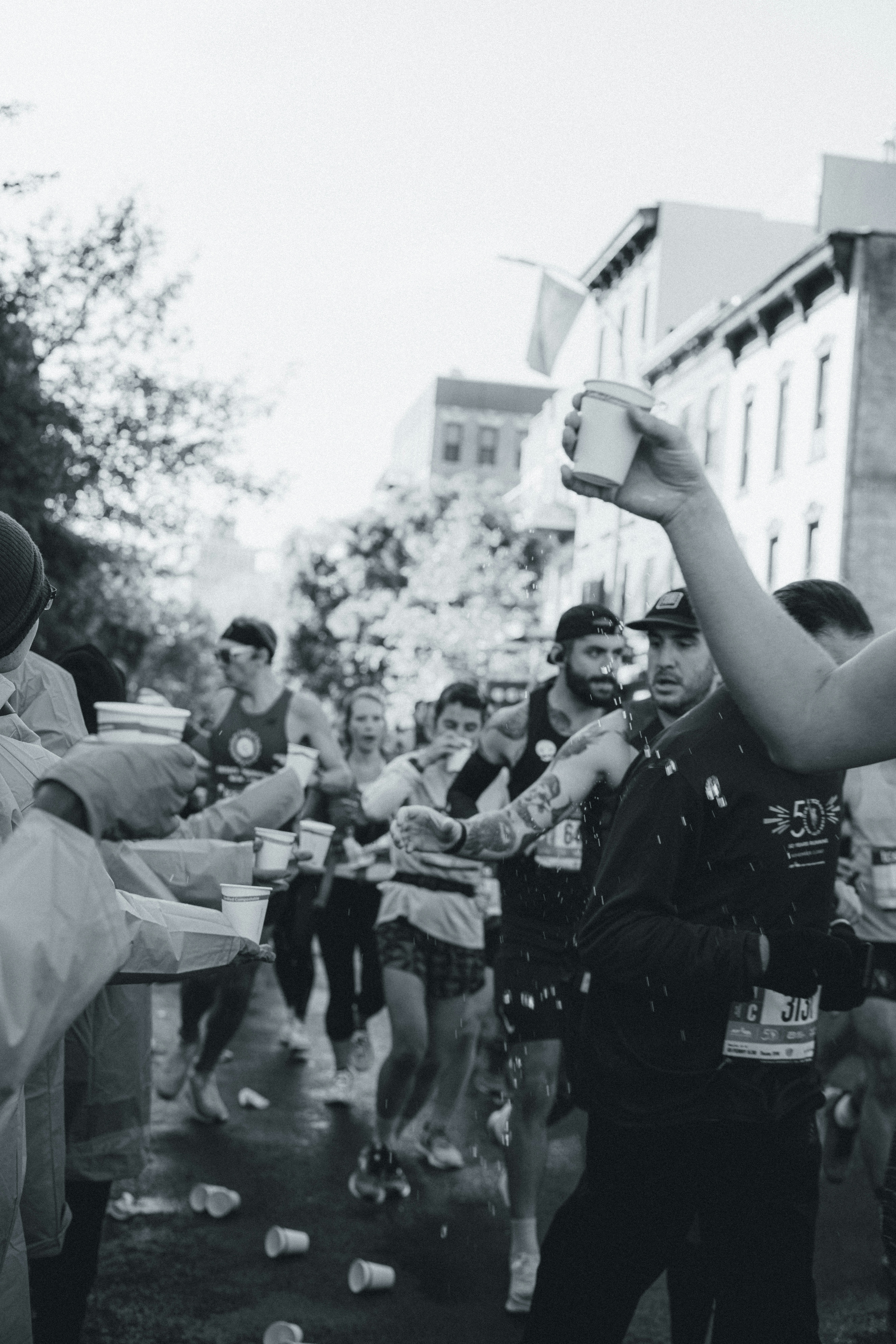 a group of people standing around each other