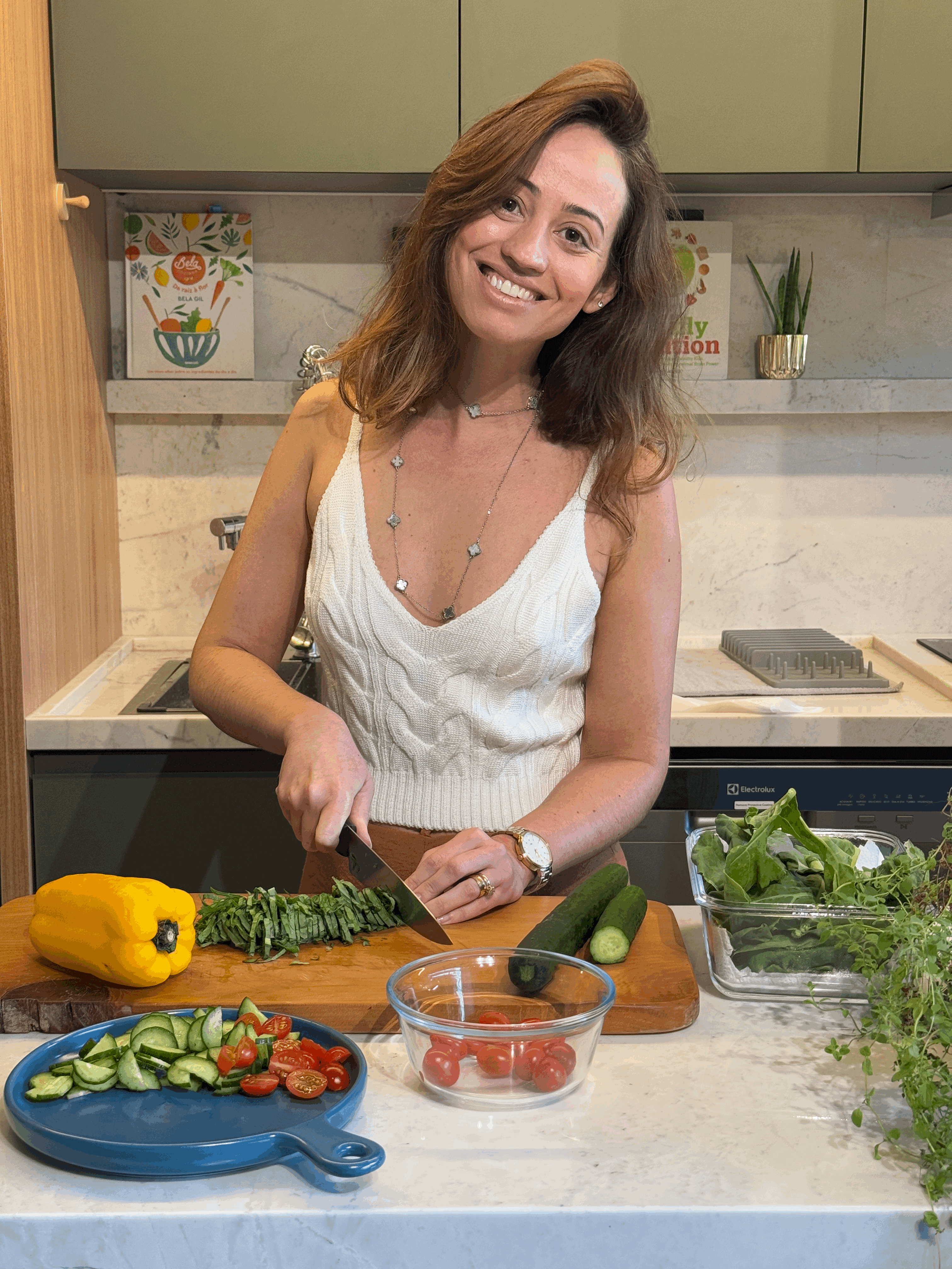 Portrait of a woman with long red hair and closed eyes, gently touching her face with both hands