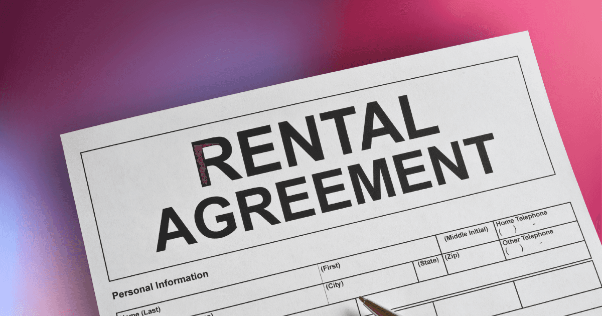 A paper with the text "RENTAL AGREEMENT" on it