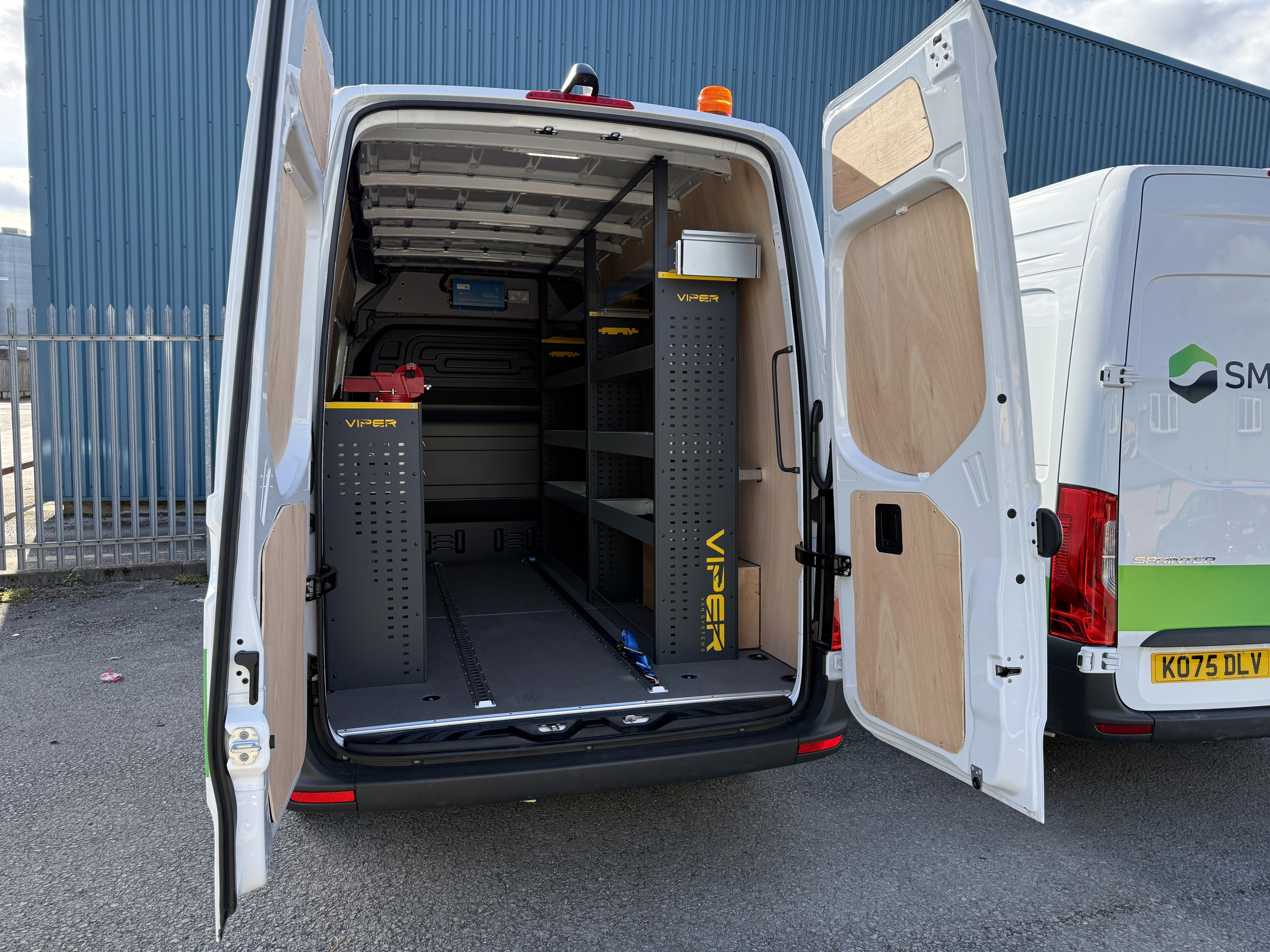 "Telecoms fleet van conversion UK with organised racking and interior lighting"