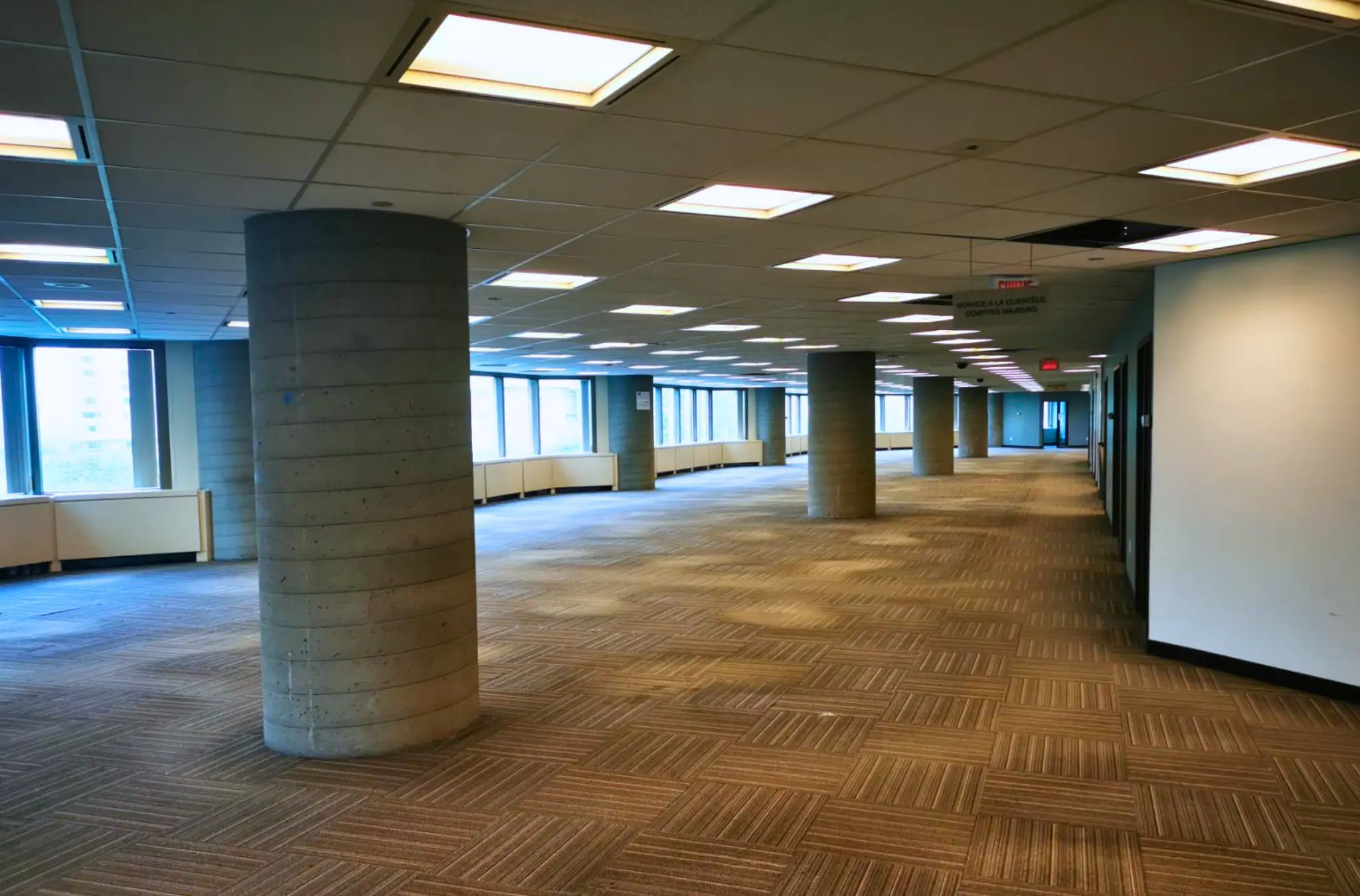 Cleaned office space after site cleanup and decommissioning with cleared floors and empty workspace
