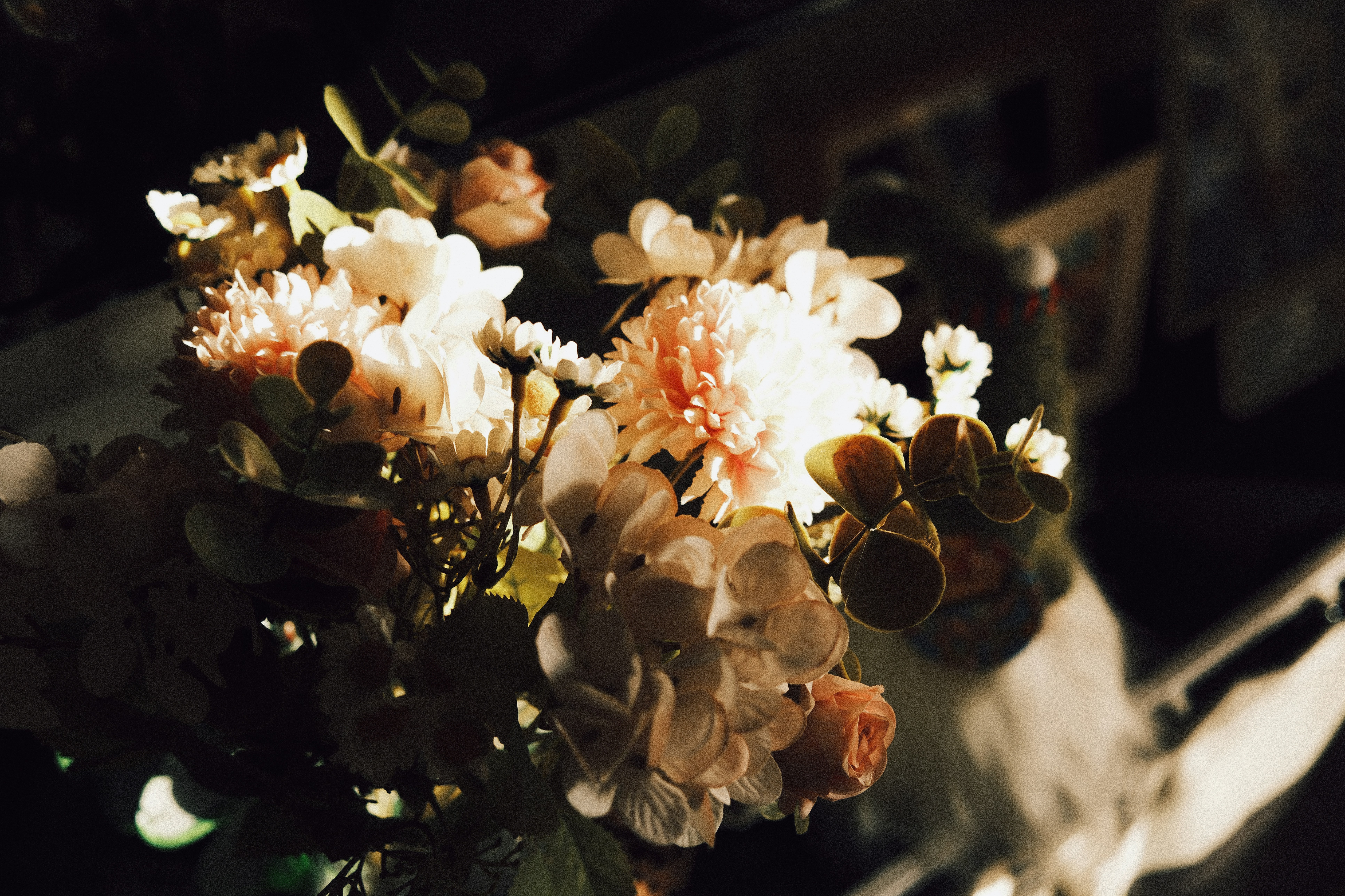 A soft bouquet of light pink and white flowers.