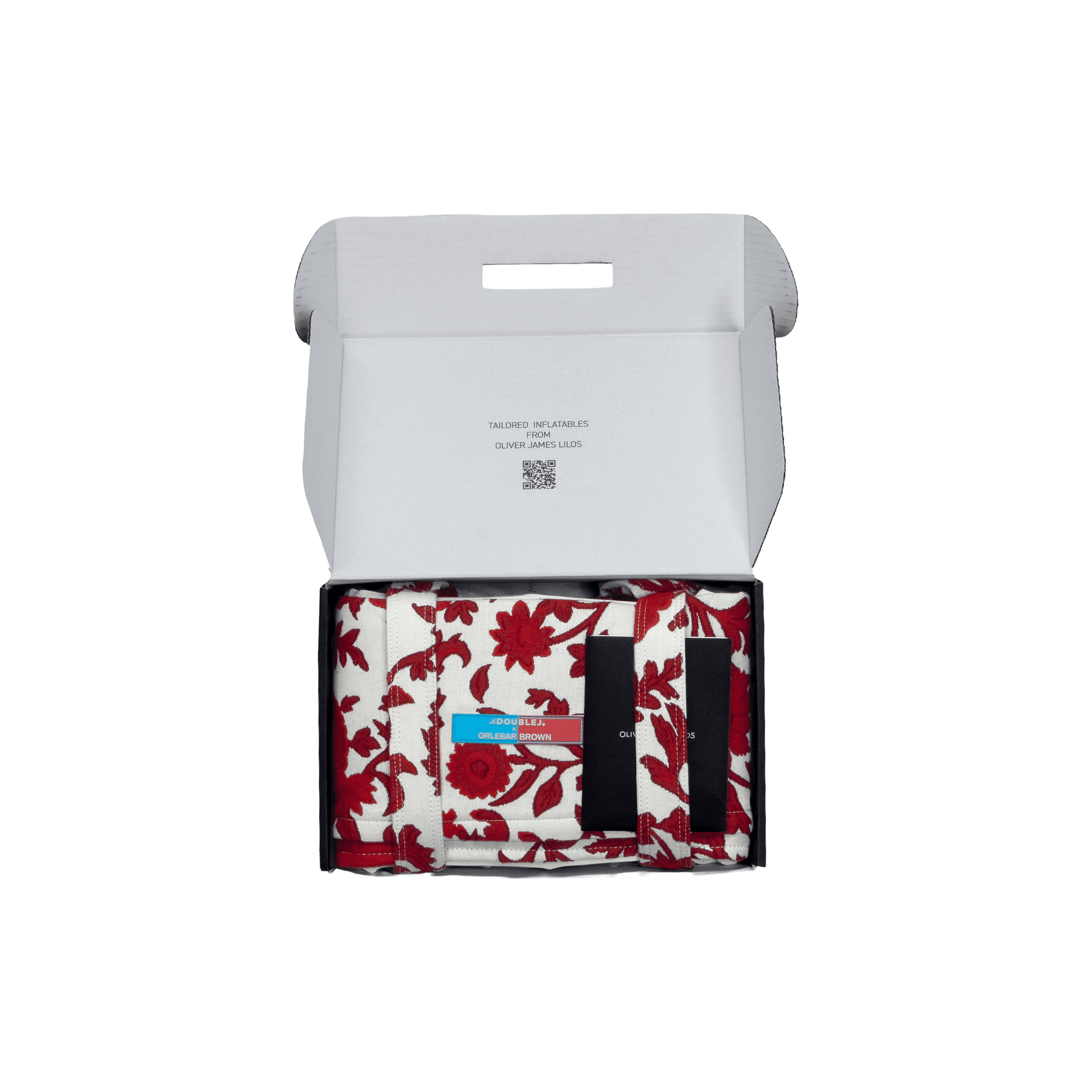Red-and-white Dragonflower lilo folded in its structured black travel case with branded label and securing straps