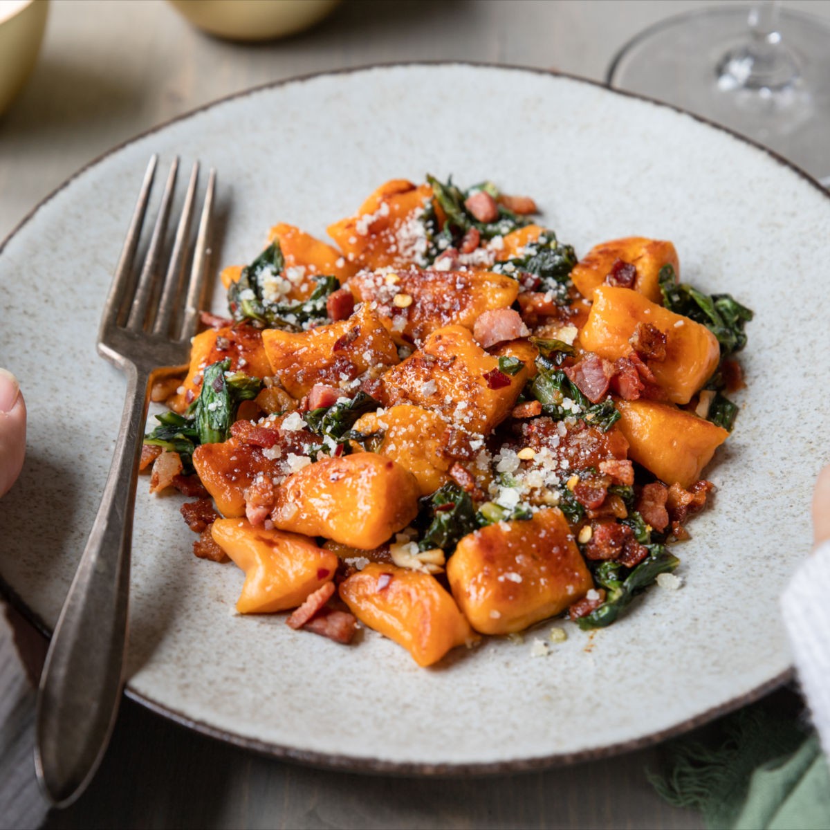 Sweet Fire Gnocchi from PASTA 9 Toronto, soft sweet potato gnocchi tossed in chili-sage butter with spinach and Parmesan.