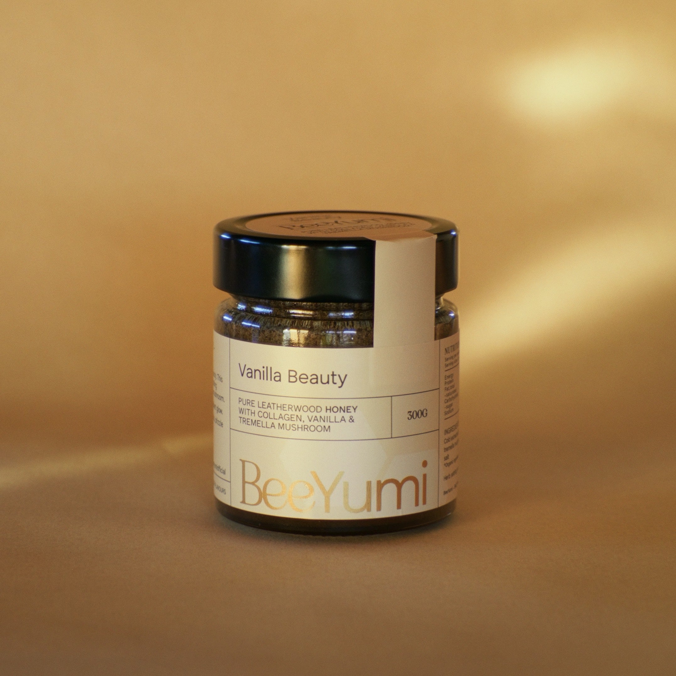 Jar of 'Vanilla Beauty' by BeeYumi on a beige background