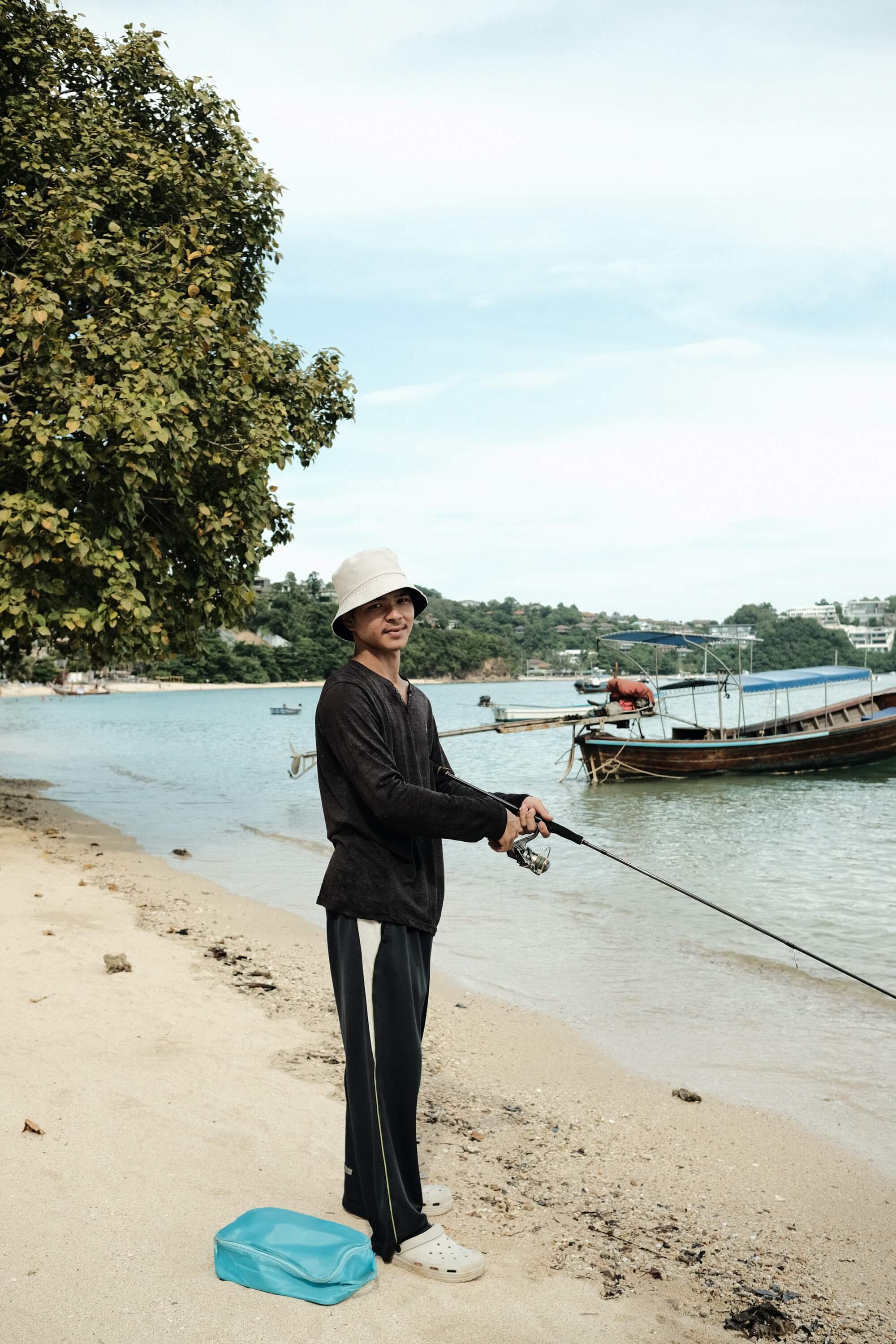 Thai man fishing on beach