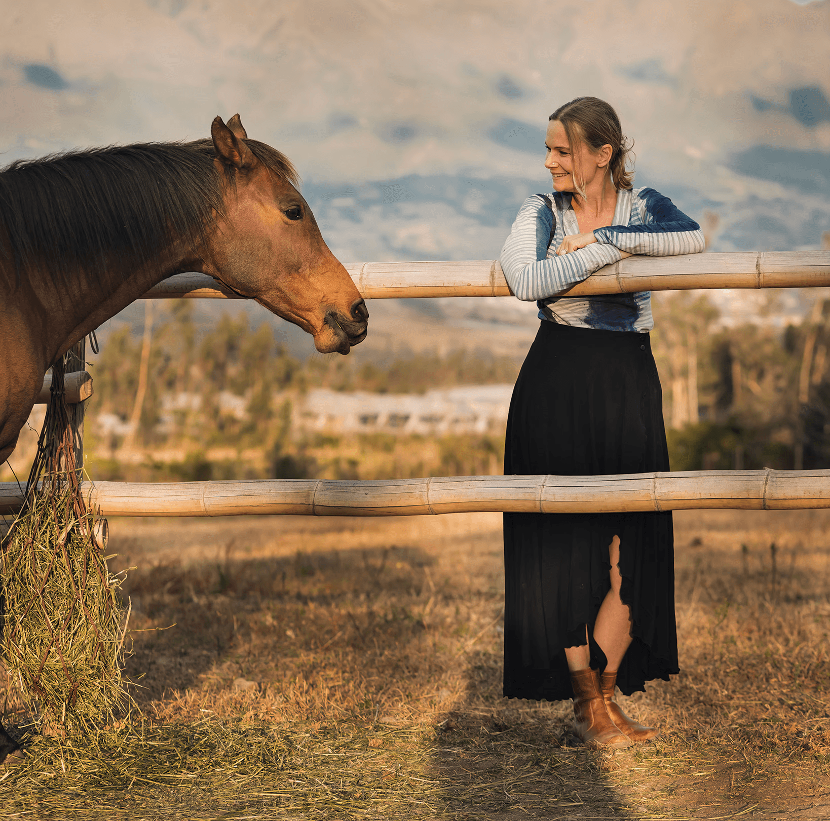 Christina Marz and a horse outdoors, symbolizing the connection central to horse-guided empowerment and mental health therapy.