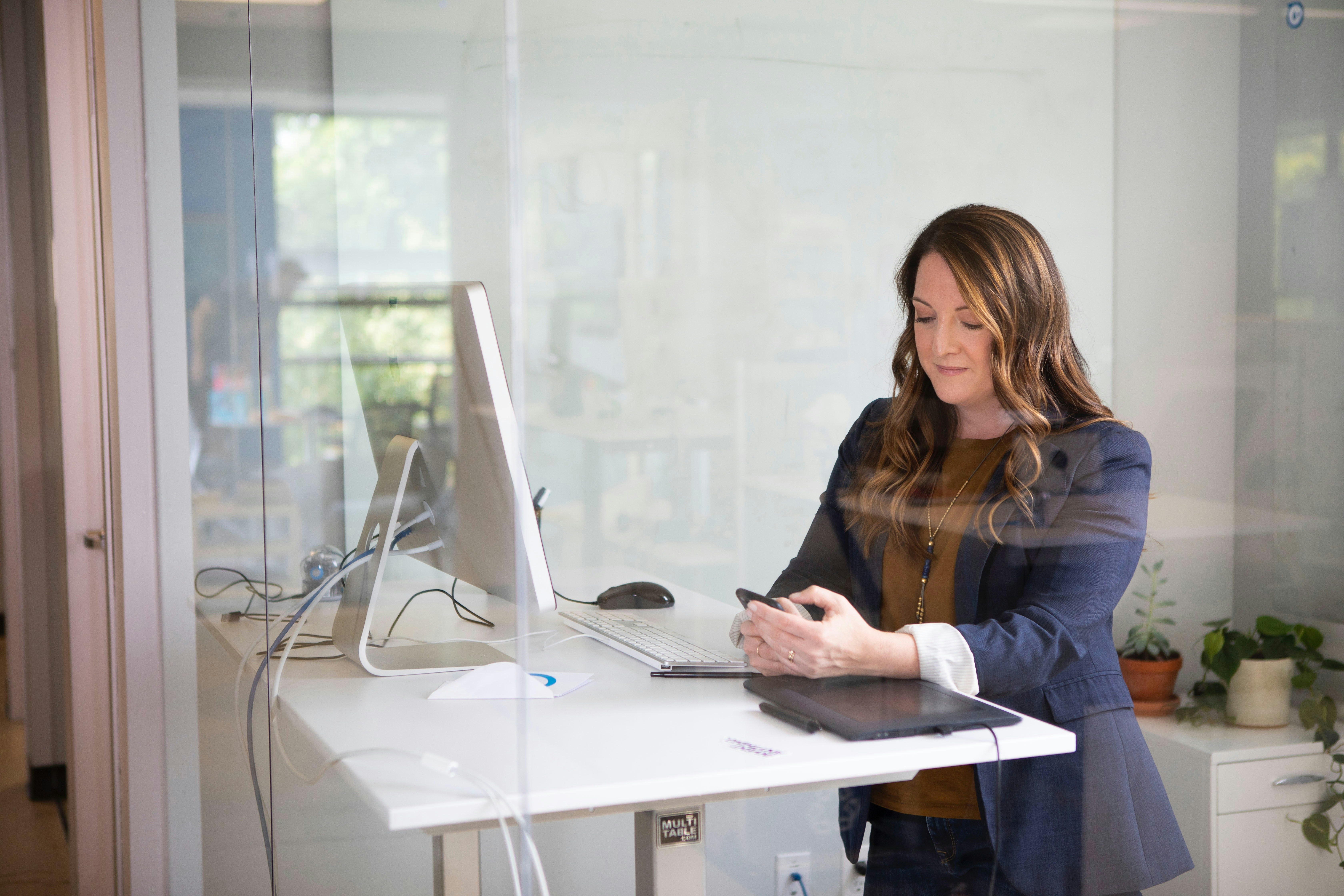 woman alone in her office - AI for Administrative Tasks