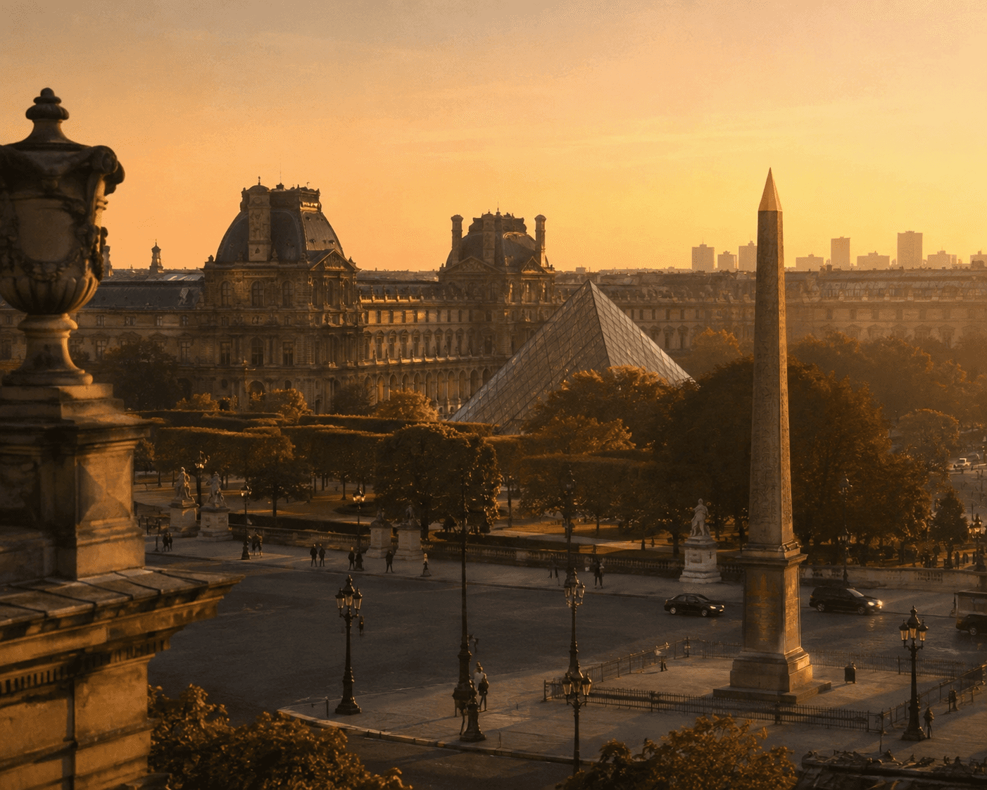An elevated golden hour view looking over Paris towards the Louvre Museum. The iconic glass Louvre Pyramid and historical Palace architecture stand in the background bathed in warm sunset light. In the foreground plaza, an ancient Egyptian obelisk with a gold-tipped top stands tall, framed by decorative stone urns, vintage street lamps, autumn trees, and distant city skyscrapers under a soft orange sky.