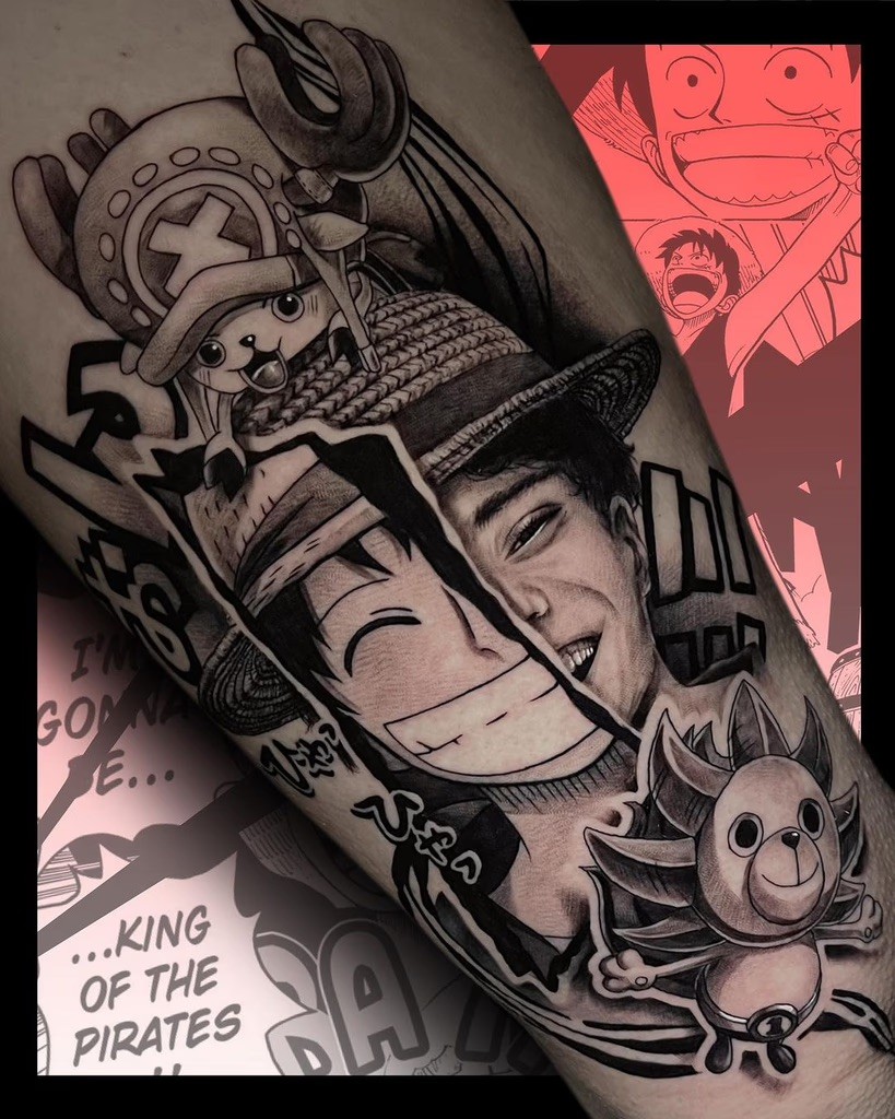 A unique split-style tattoo blending realism and anime art. The left side features Luffy’s iconic grin in anime style, while the right shows a realistic interpretation. Chopper sits playfully atop Luffy’s straw hat, surrounded by manga-inspired details and a touch of humor.