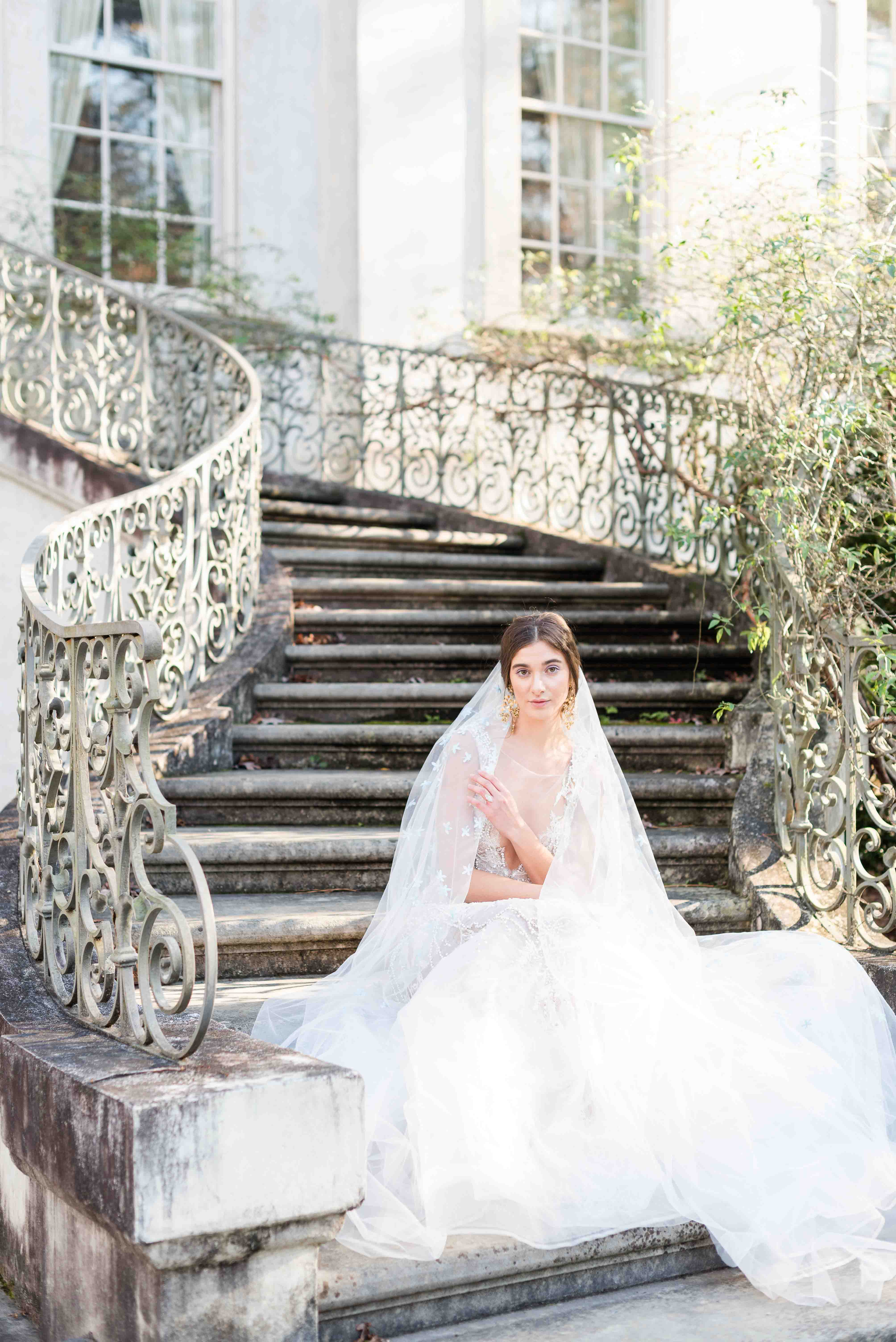 Bridal portrait sitting on the steps at the Swan House in Atlanta, Georgia.