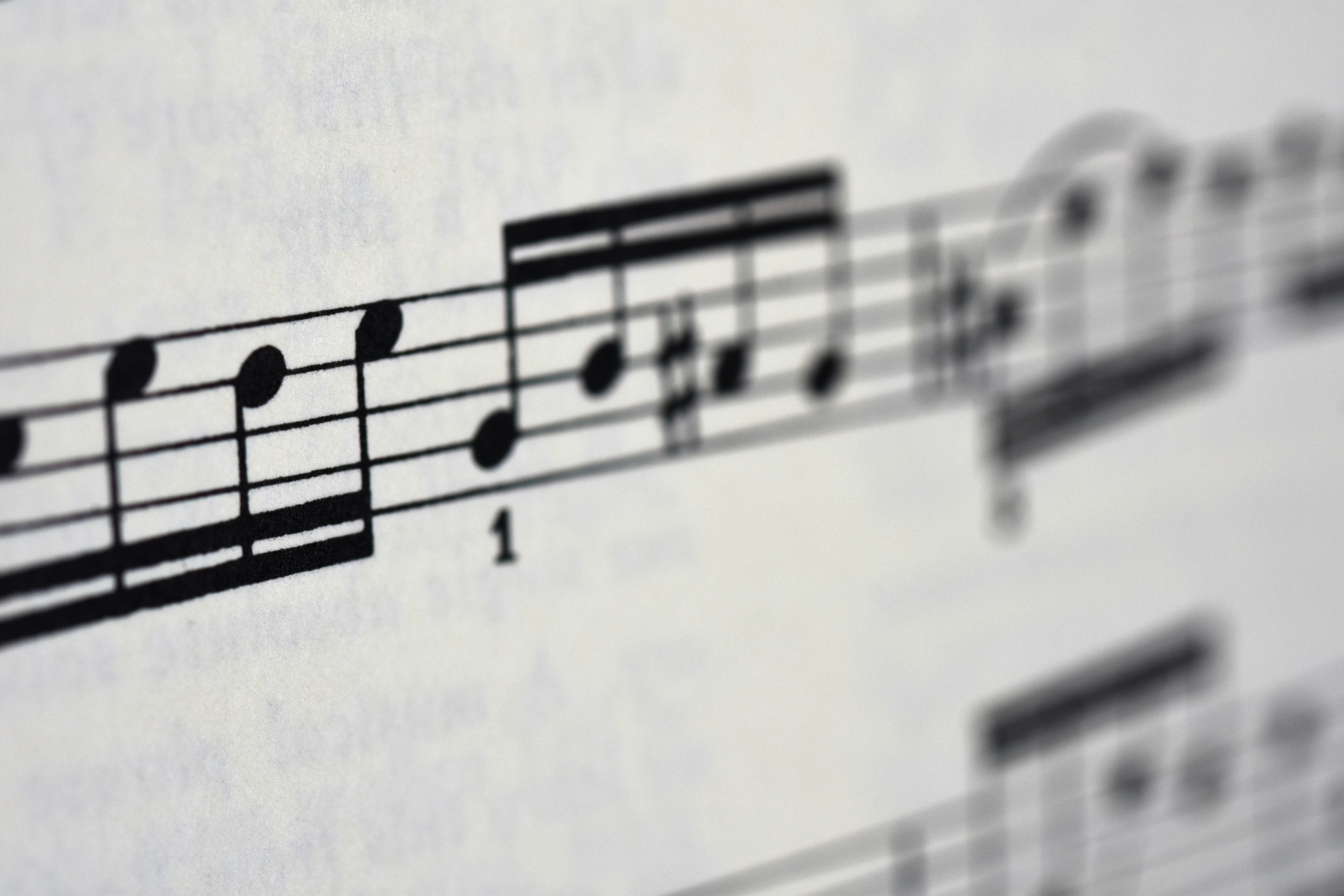 Sheet music on paper. Photo by Mike Castro Demaria on Unsplash