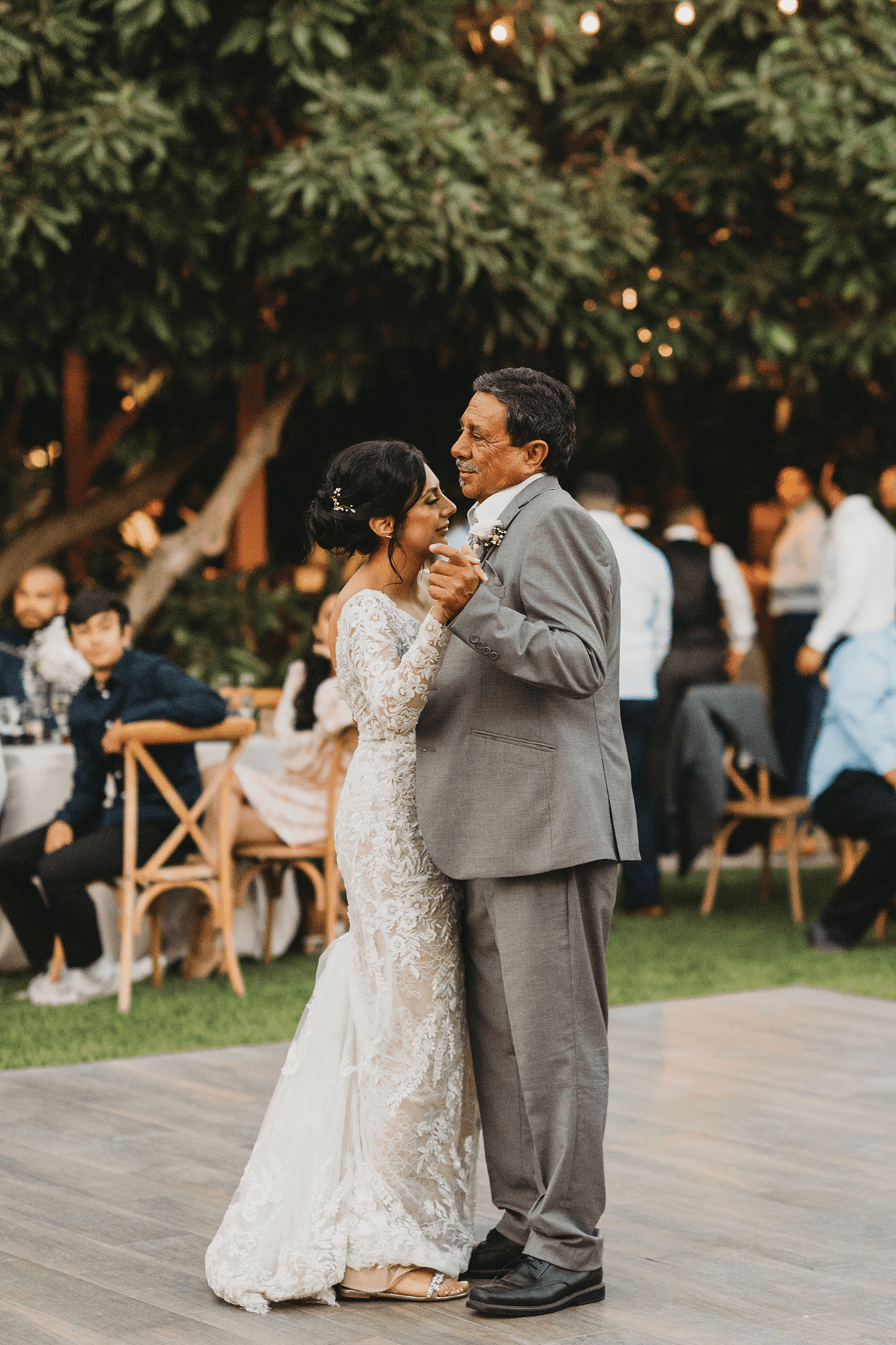 Flat lay wedding details with bouquet, rings, and sparkling bridal heels