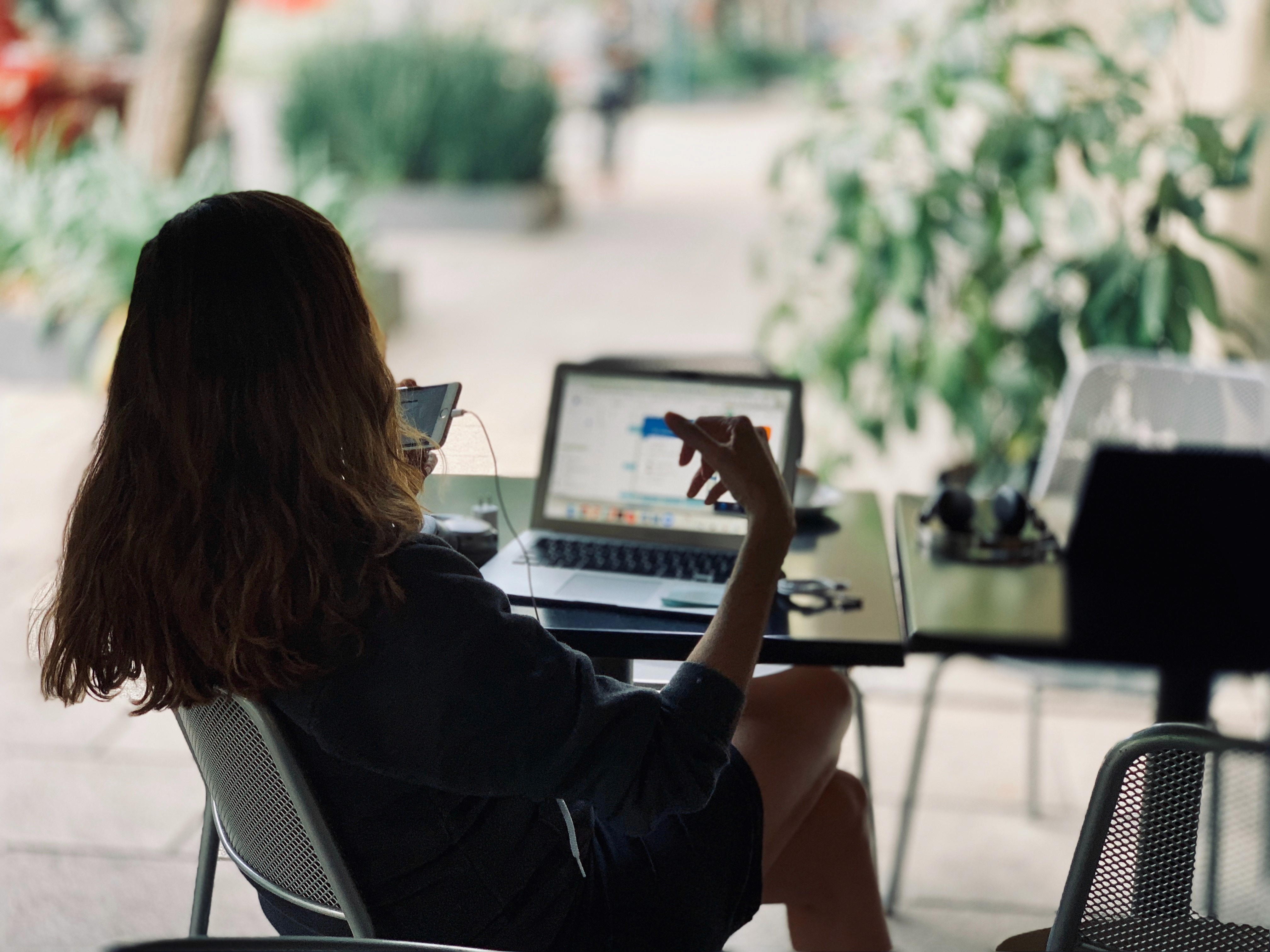 Person working on a laptop during a professional financial consultation