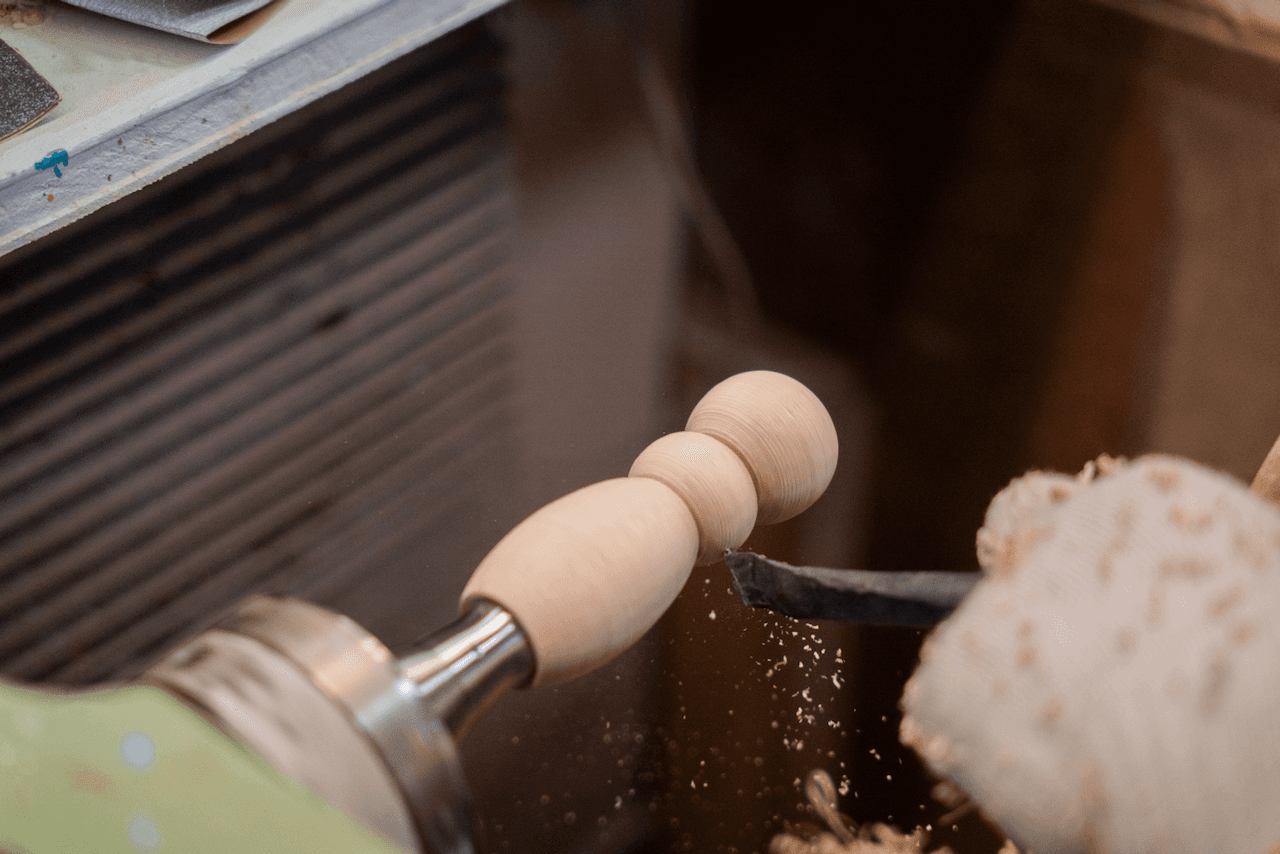 Kokeshi doll being carved