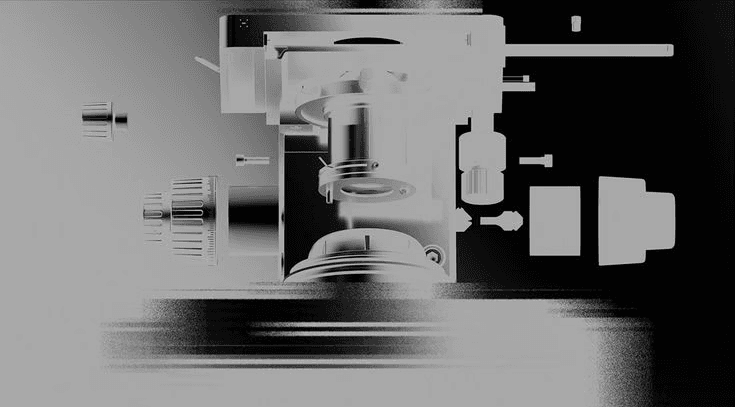 a silver metal object with a white background