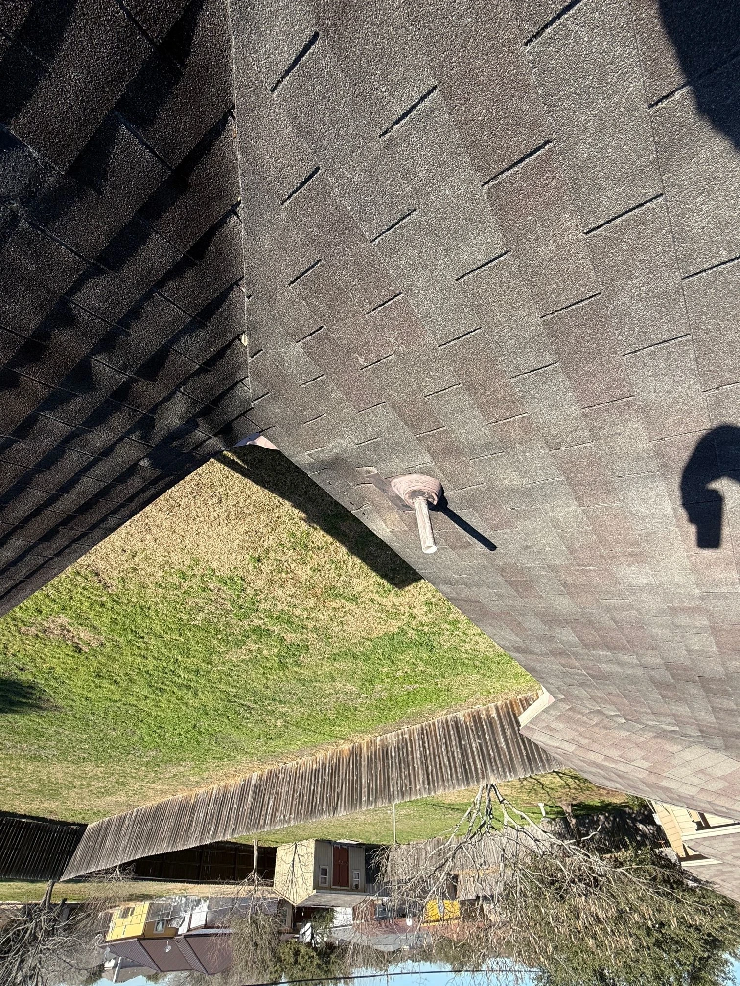 Before repair: leaking pipe area and shingle repair in New Braunfels, Texas.