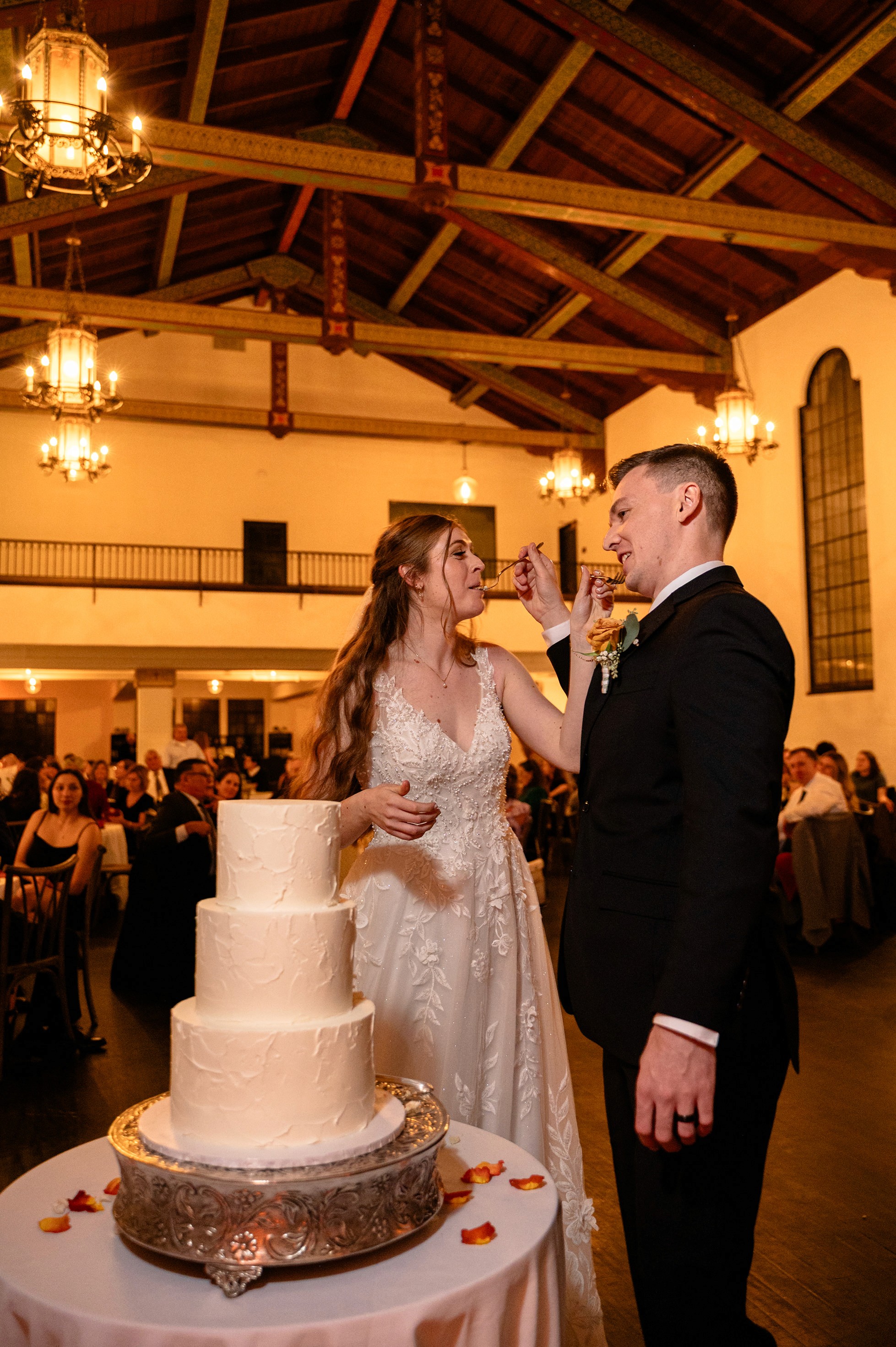 Flat lay wedding details with bouquet, rings, and sparkling bridal heels