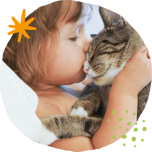 girl kissing a cat