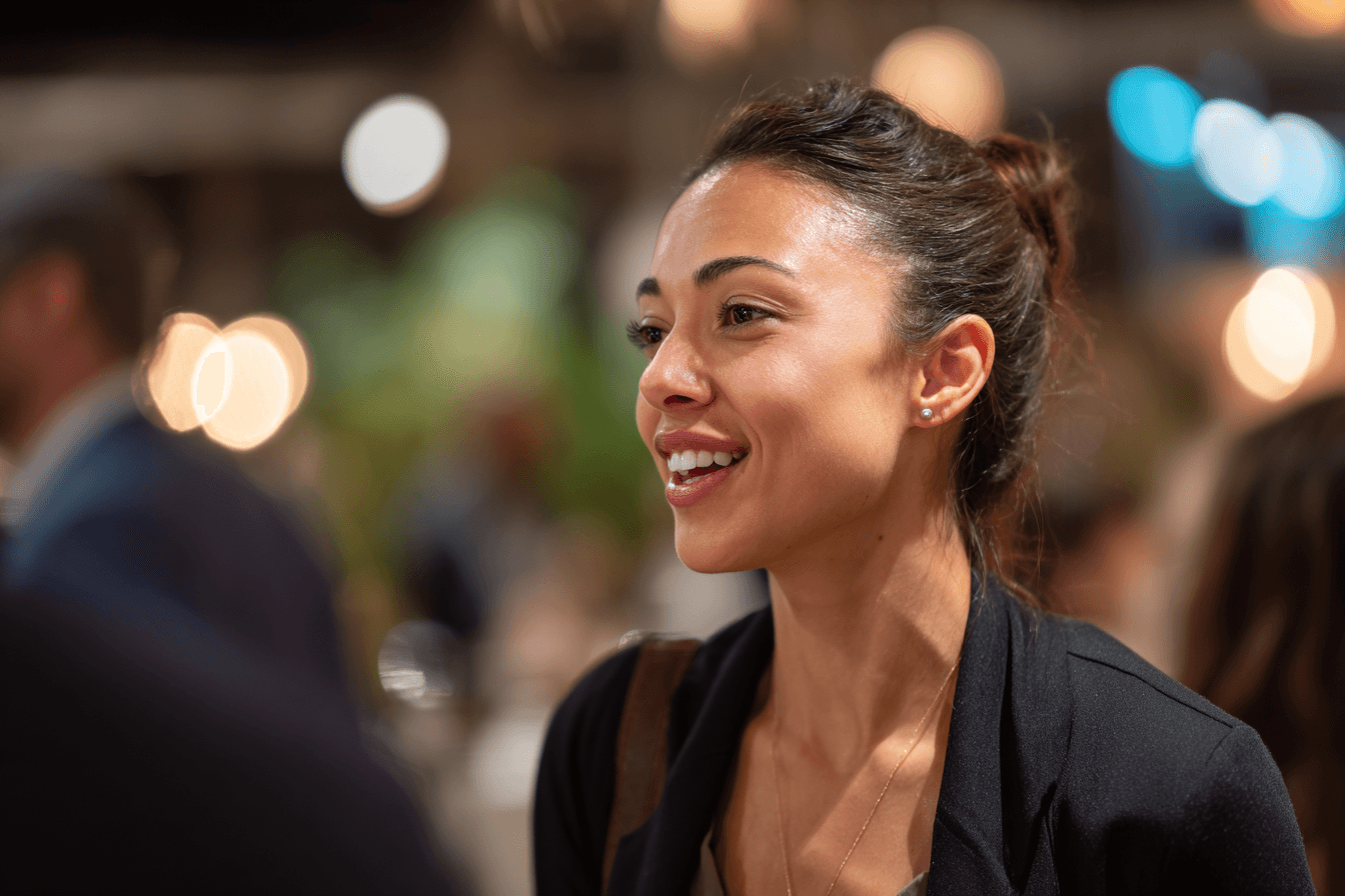 a home care agency marketer, female in her 30s, dressed professionally, at a networking event, speaking with various professionals