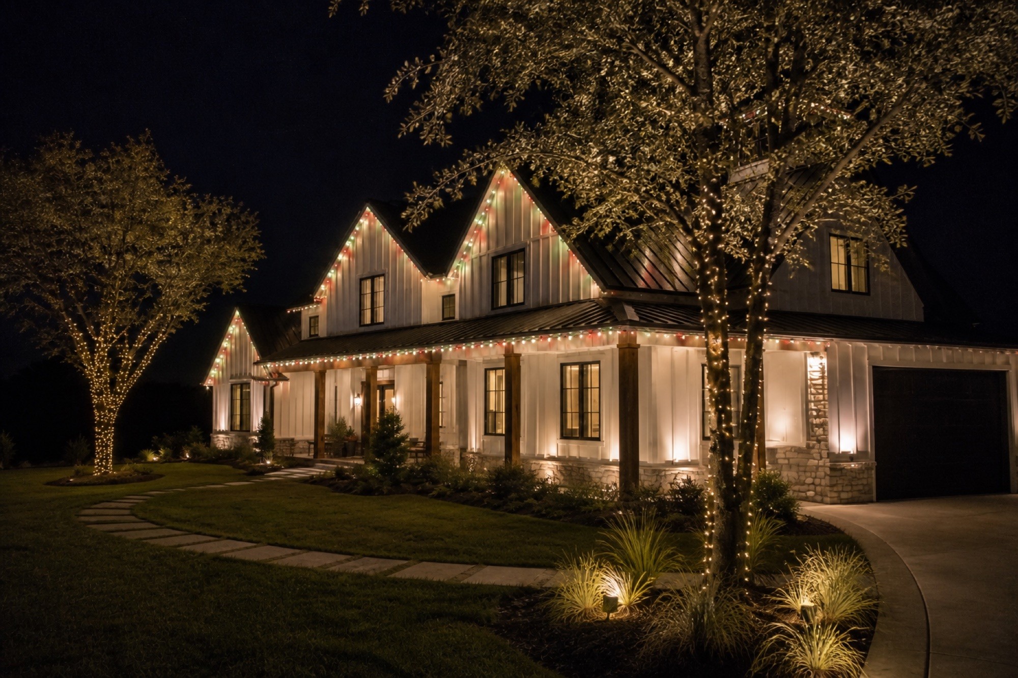 Crew-installed roofline track lit warm white at night