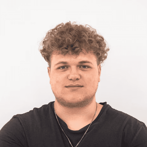 man in white crew neck shirt smiling