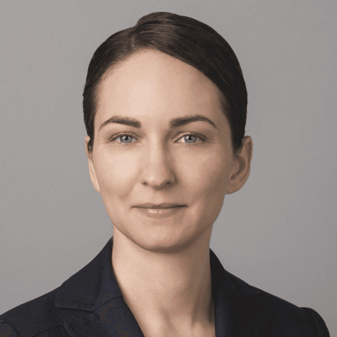 smiling woman in white and black checkered dress shirt