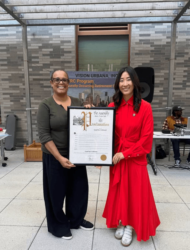 Assemblymember Grace Lee presents a proclamation for Hispanic Heritage Month to a Grand Street employee.