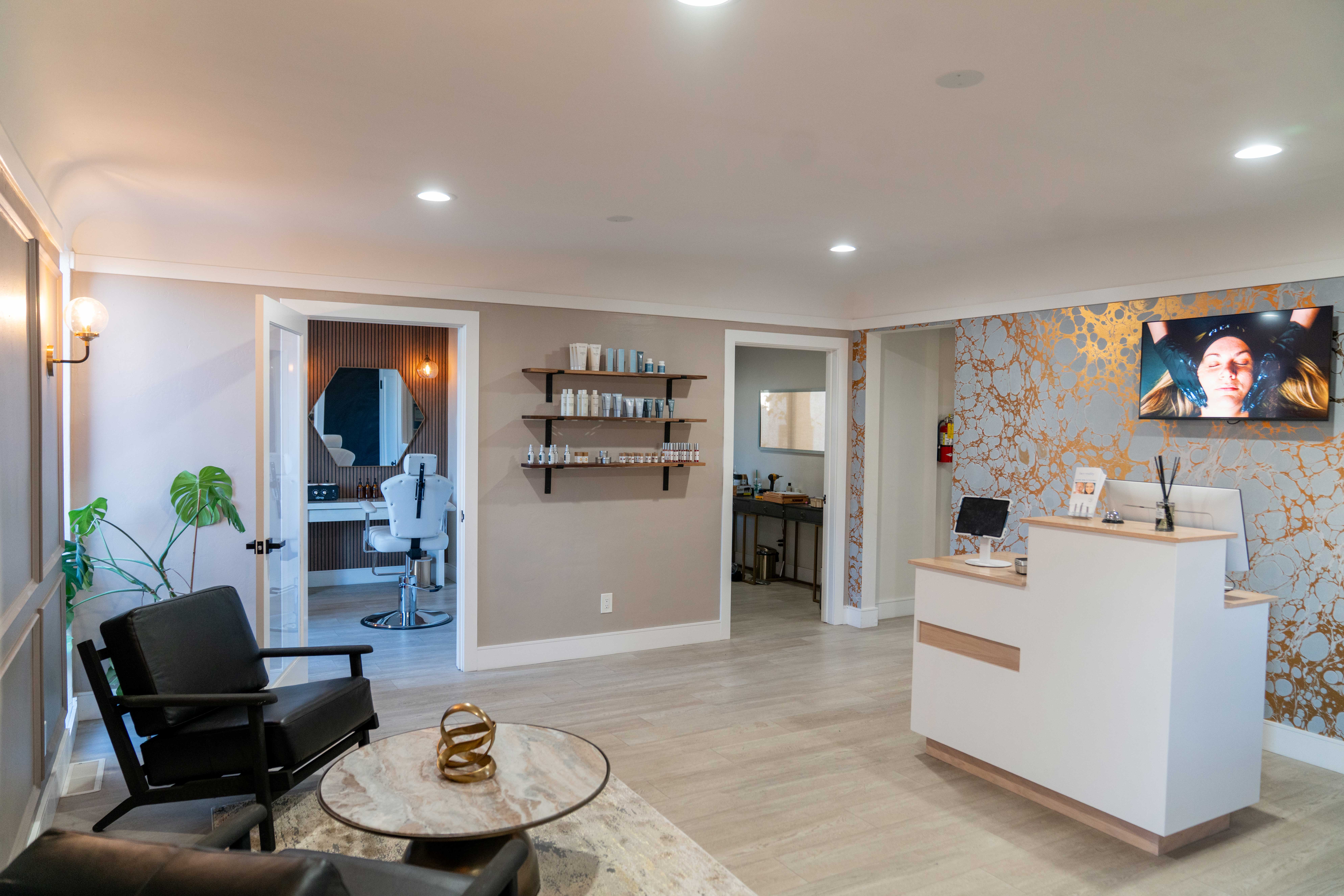 A large group photo of diverse team members gathered in an industrial-style space with arched ceiling.
