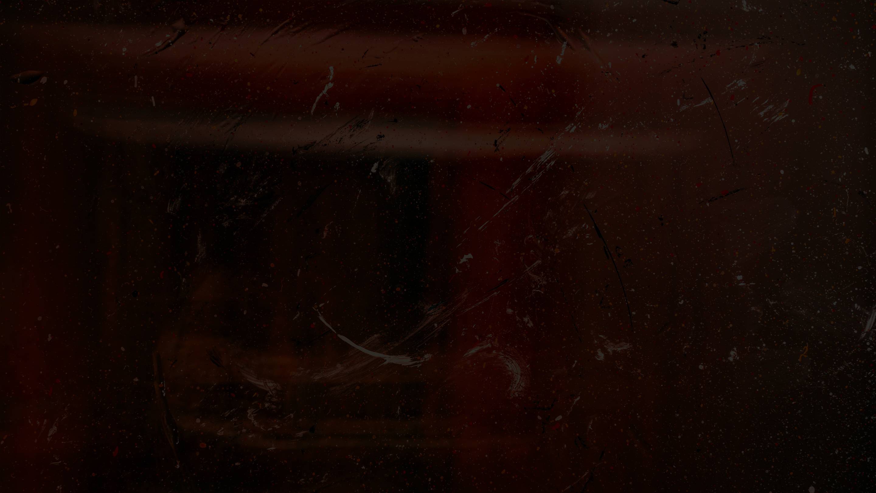 Dark textured surface with a faint pink glow.